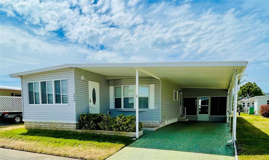 Location is a standout feature of this spacious two-bedroom, two-bath double-wide manufactured home, ideally situated in a non-flood zone within Blue Jay Estates, a friendly 55+ community where you OWN YOUR LAND!

This move-in ready home offers 1,012 square feet of interior living space with a bright, open feel, vinyl flooring throughout, and plenty of storage—including walk-in closets in both bedrooms. Additional living space includes a 120-square-foot enclosed front porch—perfect for a home office or reading room—and a 200-square-foot enclosed side porch ideal for relaxing or entertaining, bringing the total usable living space to approximately 1,332 square feet.

The home is well maintained inside and out, featuring attractive landscaping, two vehicle carport, decorative driveway, skirting, and privacy lattice for added shade and seclusion. A 64-square-foot utility shed houses the washer and dryer and provides additional storage space. Energy-efficient upgrades include double insulated windows throughout, an insulated roof-over, and a tankless water heater for enhanced comfort and efficiency.

Walking distance to the community pool and clubhouse, residents enjoy an active lifestyle with a social club, planned activities, a heated pool for year-round use, shuffleboard, and bocce courts. A designated area is also available for boat or RV parking at no additional cost (subject to availability).

The low monthly fee of $230 includes water, sewer, trash, lawn care, and escrow reserves—offering easy, low-maintenance living. Conveniently located near beaches, the Pinellas Trail, parks, shopping, medical facilities, and airports, this home delivers both comfort and convenience.