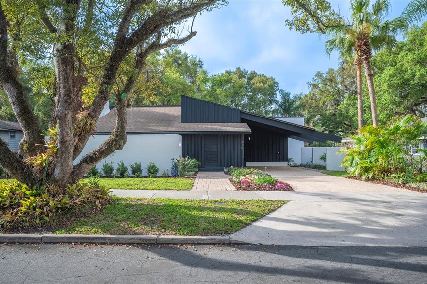 Originally built in 1922, this distinctive historic home near downtown Lakeland blends classic architecture with an extensive list of thoughtful updates completed over the years. The property was purchased in 1964 by renowned architect Ludwig Spiessl as his personal residence, and was extensively redesigned and expanded during his ownership. Spiessl received the prestigious AIA Medal of Honor in and the AIA Levison Award. Today, the home offers more than 2,600 square feet of living space with formal living and dining rooms, a Florida Room, four bedrooms, two full bathrooms, a bonus room, a laundry rom and a large storage closet (perfect for storing holiday decor or as a hobby room). Over the years, the property has undergone numerous architecturally designed updates and include recent improvements to electrical and plumbing systems, kitchen and bathrooms, roof, skylights, HVAC system and ductwork, flooring, both water heaters, appliances, landscaping, and interior and exterior paint.  Architectural character remains a highlight throughout the home with graceful arches and historic doors and baseboards adding character to the home. Professionally restored 104-year-old red oak floors enhance the formal living room, dining room, and second bedroom, while durable vinyl flooring throughout the other areas of the home complements the mid-century design elements introduced during renovations. The dining room features classic mid-century built-ins, and the Florida room with neutral tile flooring, includes custom bookcases overlooking the private walled-in courtyard and Zen fountain. Other outdoor living spaces include a spacious rear deck ideal for relaxing or hosting barbecues and family gatherings. The grounds are accented by lush tropical landscaping, creating multiple areas to enjoy the outdoor setting. An outdoor storage shed is perfect for stowing garden equipment, bicycles, or other hobby equipment.  Located on a lovely tree-lined street in an established Lakeland neighborhood, the home is within minutes of downtown amenities, including grocery stores, restaurants, banks, medical offices, shops, and everyday conveniences while also being less than 10 minutes away from access to the Polk Parkway and on to I-4.  Make your showing appointment today!