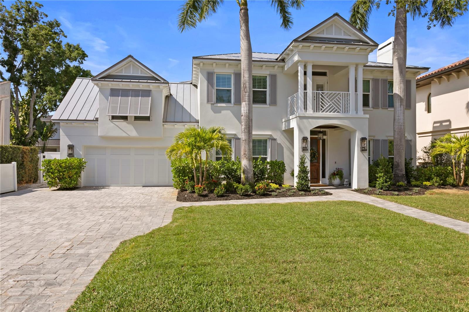 Luxury living awaits in Bayshore Beautiful! This 3,871 sqft coastal contemporary pool home sits only 300 ft from the sweeping views of Bayshore Blvd and offers every amenity you could think of. This stately home was originally constructed by Hyde Park Builders and in 2016, Lloyd Craftsmen breathed new life into the property with an exceptional full-home remodel making this established residence feel like brand new construction. Included in the home’s upgrades are a metal roof, impact windows, hardwoods throughout & a spa-like backyard with a pool, spa, travertine pavers & turf lawn. The stylish interior offers an open concept first floor that's perfect for entertaining. Greet guests in your formal living and dining spaces and then flow into your relaxing great room that’s open to the sparkling kitchen and elegant wet bar. Your large open kitchen features custom cabinetry, quartz countertops, a breakfast nook with views of the pool, large pantry & top of the line appliance selections that include a gas Wolf range, Sub Zero french door fridge, and Bosch dishwasher. The gorgeous hardwoods and impeccable style carry through to the second floor where you’ll find a large bonus room with tons of storage along with all four bedrooms that each feature an en-suite bath. Your primary suite with elegant en-suite bath and large walk-in-closets also includes a private balcony & designated office or reading area that’s perfect for your work-from-home needs. This incredible property sits within the desirable Plant High School district and is only minutes from all the best South Tampa destinations. Don’t miss out on this stunning property!