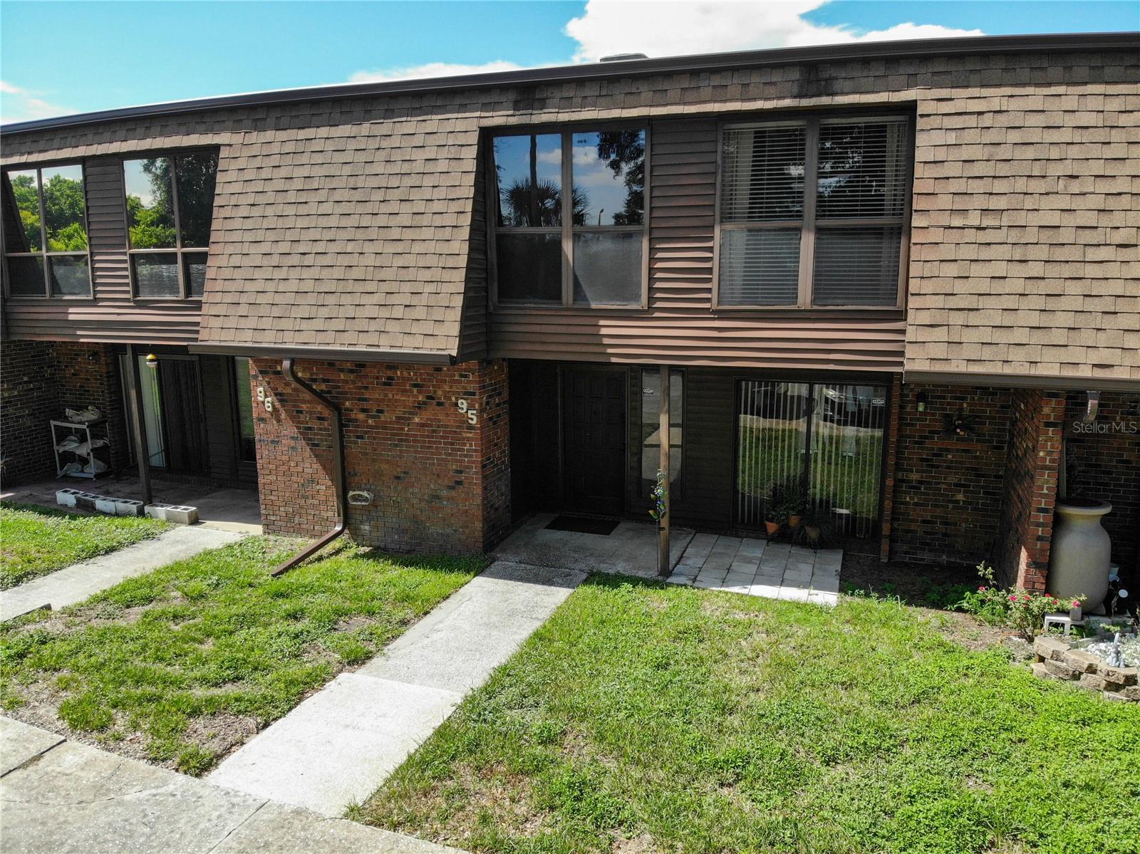 If you are looking for a maintenance free Florida lifestyle, in a four bedroom townhome, with two community pools, and it's near downtown Lakeland then this home might be the answer. This home has a lot of space inside and out downstairs. The great room, dining and kitchen are open in this floorplan design, and there is a convenient half bathroom for guests nearby. The kitchen has been upgraded with granite countertops and has lots of surface space for those who like to cook and bake. They eat at breakfast bar is also convenient for a quick meal in the morning or after a long day at work. There is a large screened in, covered lanai at the back of the house, which is great for relaxing during the mild, Florida Winters. Upstairs there are four well sized bedrooms, one is being used as a study currently. The master bedroom has a nice walk-n closet and has its own en-suite bathroom with standalone shower configuration. The secondary bedrooms share another full bathroom with built-in shelving. Families and pet owners will love that there are no carpets in this home - all of the floors have hard surfaces. There is a community pool adjacent to this townhome building, and there is also a small clubhouse and pool adjacent to the nearby lake, which offers beautiful sunset views. The property is very near to the local Publix Plaza and minutes from downtown Lakeland. If you like First Friday, the food truck rally, the farmers market and other downtown activities you will love the proximity to your new townhome. Please have a look at the pictures, take a virtual tour, and if you like what you see, please request a showing today. *** UPDATES and MAINTENACE: The house was replumbed 2024. Roof replaced 2018-2019. New wiring was installed prior to the current owners purchase. The AC is serviced by Alexander Air. *** This won’t last long at this affordable price. Come take a tour today!