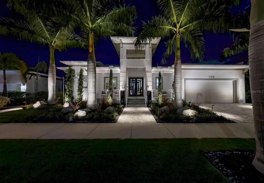 A ONE-OF-A-KIND WATERFRONT SHOWPIECE WITH EXCEPTIONAL ENHANCEMENTS! Experience the finest of Florida’s waterfront living in this exceptional 4-bedroom, 3-bath modern masterpiece filled with high end features in the gated community of MiraBay. Perfectly positioned on a saltwater canal with a private dock and 16,000-LB BOAT LIFT, this impeccably upgraded home blends refined elegance, smart technology, and true resort-style outdoor living. From the moment you arrive, the home impresses with LUSH  MANICURED LANDSCAPING AND LIGHTING, AND CUSTOM-PAVED SIDE YARDS that lead you to the dock. Inside, an elegant foyer with 22’ CEILINGS, A CUSTOM FRONT DOOR, AND A DESIGNER CHANDELIER sets the tone for the home’s refined finishes. The living room features VAULTED CEILINGS WITH DECORATIVE BEAMS, A 60" ELECTRIC FIREPLACE, 96" MONTE CARLO FAN, PLANTATION SHUTTERS, SOLID HARDWOOD INTERIOR DOORS, AND POLISHED PORCELAIN TILE throughout. The chef’s kitchen is a showpiece with GE MONOGRAM APPLIANCES, INCLUDING a 48" DUAL-BUILT IN REFRIGERATOR, 48" DUAL-OVEN GAS RANGE WITH SIX BURNERS AND GRIDDLE, POT FILLER, IN-CABINET MICROWAVE, QUARTZ COUNTERTOPS, DUAL ISLANDS, HAMMERED STAINLESS FARM SINK, CUSTOM CABINETRY, HATTERAS BAY PENDANT LIGHTS, ABOVE CABINET LIGHTING, BUILT-IN BAR WITH WINE STORAGE, A DEDICATED COFFEE BAR WITH WATER FILLER, WINE FRIDGE AND ICE MAKER, ideal for entertaining. The private owner’s suite offers custom drapery, an 84” FANIMATION FAN, and expansive his- and her CUSTOM CLOSETS. The spa-inspired bath includes a VICTORIA & ALBERT SLIPPER TUB, OVERSIZED DUAL-HEAD SHOWER AND DUAL VESSELL SINKS. A beautifully designed office features CUSTOM GLASS SLIDING DOORS, while the laundry room provides extensive cabinetry, and a stainless farm sink. Outdoor living is truly resort-level with a CUSTOM L-SHAPED POOL FEATURING A SUNDECK, AND RGB LIGHTING. all within a fully screened cage with INTERGRATED LIGHTING. Entertain beneath the 10X16 AUTOMATED PERGOLA WITH REMOTE-CONTROLLED LOUVERS, BUILT-IN LIGHTING AND AN IMPRESSIVE 11-FT FIREPLACE. The outdoor kitchen rivals any indoor setup with DUAL REFRIGERATORS, LYNX 36" GRILL AND SIDE BURNER, OVERSIZED EXHAUST HOOD, pizza oven and smoker prep area. A designer fire table completes the space. Additional upgrades include a full security whole-house SONOS AUDIO SYSTEM AND EXTERIOR CAMERAS, CENTRAL VACUUM SYSTEM, WATER SOFTNER, DUAL TANKLESS WATER HEATERS, HURRICANE-RATED WINDOWS/DOOR/SLIDERS, AND FOAM ROOF INSULATION for superior efficiency. The oversized 2-car garage offers SAFE-RACKS for extra storage and an INSULATED GARAGE HURRICANE RATED DOOR. For boating enthusiasts, the dock has a HIGH-CAPACITY LIFT AND 12-FT BEAM POLES. The direct waterway offers effortless, bridge-free access to Tampa Bay and the Gulf, perfect for serious boaters and sunset cruisers. Located in the sought-after MiraBay community, residents enjoy a waterfront clubhouse, Café, resort style pool, fitness center, tennis, pickleball and basketball courts, kayaking, and year-round events. This exceptional residence delivers luxury design, modern efficiency, and true waterfront resort living in one of Tampa Bay’s most desirable coastal neighborhoods. Don’t miss your opportunity to tour this beautiful coastal waterfront home! Schedule your showing today!