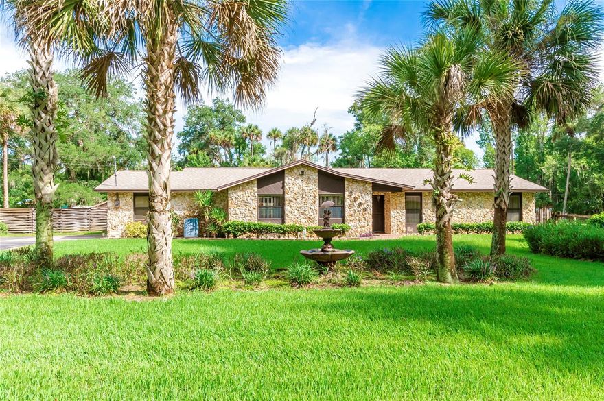 JUST BRING THE HORSES! 1.25 cleared acres with a 3 bedroom 2 bathroom pool home that includes a 2 car garage and a detached garage with a separate shed! Kitchen has updated stainless steel appliances. Updated vinyl wood flooring and tile. Carpet in the bedrooms for comfort. Wood burning fireplace, Large screened in porch next to your large screened pool enclosure with rock waterfall. Master bedroom walks out to pool. Beautiful tongue and groove wood vaulted ceilings in your large living area and formal dining area. Separate laundry room. Very desirable home in the very desirable area of Corbin Park. ;Water: City