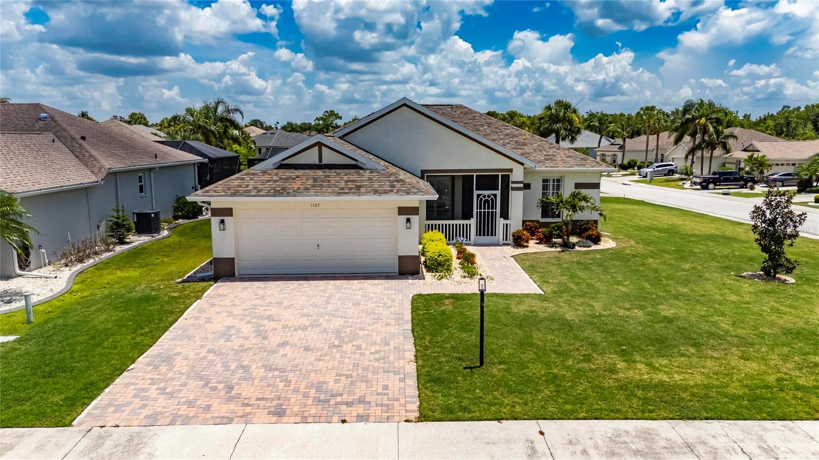 Beautifully updated home, in the desirable adult community of Sun City Center. From the moment you arrive, the expanded paver driveway, large corner lot, new grass and landscape make a bold first impression. A quaint screened front porch welcomes you inside. The elegant interior is filled with upscale details including high ceilings, luxury vinyl (15mil) flooring, plantation shutters. The open-concept layout places the kitchen at the heart of the home, where you’ll find quartz countertops, wood cabinetry, soft close drawers, large breakfast bar, and tile backsplash. The split-bedroom layout gives the master suite its own private wing, complete with tray ceilings, two closets, and bathroom with wood vanity and a curbless tile shower. A hallway door provides your guest with complete privacy in the second bedroom. Wake up with a mug of coffee on the rocking chair back porch, watch the sunrise and let the day unfold. Additional upgrades include roof (07/2024,Owens Corning-25yr), seamless gutters, vinyl soffit, fascia, appliances, tankless water heater, water softener, utility sink, LED lightings, remote control fans, etc. HVAC changed on 3/5/22. The 2024 survey is attached. Amenities include community pools (indoor and outdoor), fitness, shuffleboard, softball, lawn bowling, pickleball, lapidary, art, wood carving and more. You can join one or more of over 200 clubs and activities, and golf courses. Golf carts are a secondary means of transportation, and you can easily access grocery stores, restaurants, hospital, doctor and dentist offices, banks, hardware and grocery stores. Sun City Center is located between Tampa and Sarasota and is near airports, beaches, amusement parks, and professional sports teams.