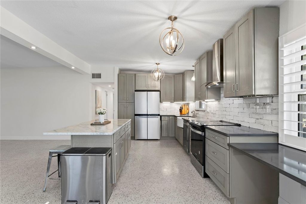 Photo of 6931 Grande Vista Way S, St Petersburg, FL 33707 (MLS # TB8493614)