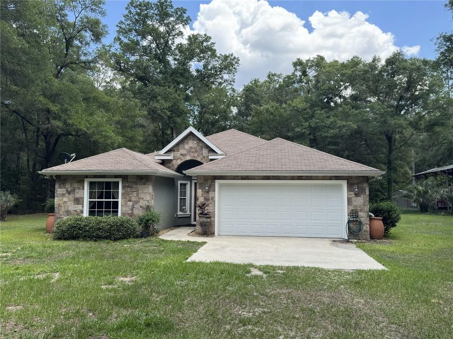 (Sneak peak - new photos coming soon!) This 3 bedroom/2-bathroom home built in 2009 on 1+ acres is on a paved road in the highly desired neighborhood of Rolling Hills. New LVP flooring (2026). Master bathroom renovated (2026) to include a walk-in shower with a built-in seat, a private water closet, a granite vanity, and dry sauna (optional). Eat-in kitchen with new refrigerator. Dedicated dining area in an open concept and dedicated laundry room. Back patio features stone pavers and ceiling fan. New AC compressor (2023). Whole-house generator (propane or gas). High-clearance pole barn for your RV or boat with 50-AMP and 110-volt electrical hookups. The property has a mix of sun and shade from a number of mature oak trees and is entirely secured with no-climb fencing. The property to the rear is an abandoned railway lined with dense woods, meaning no neighbors behind you! Rainwater catching barrels make keeping your landscape lush incredibly easy and cost-effective. Just 11 miles from the World Equestrian Center.