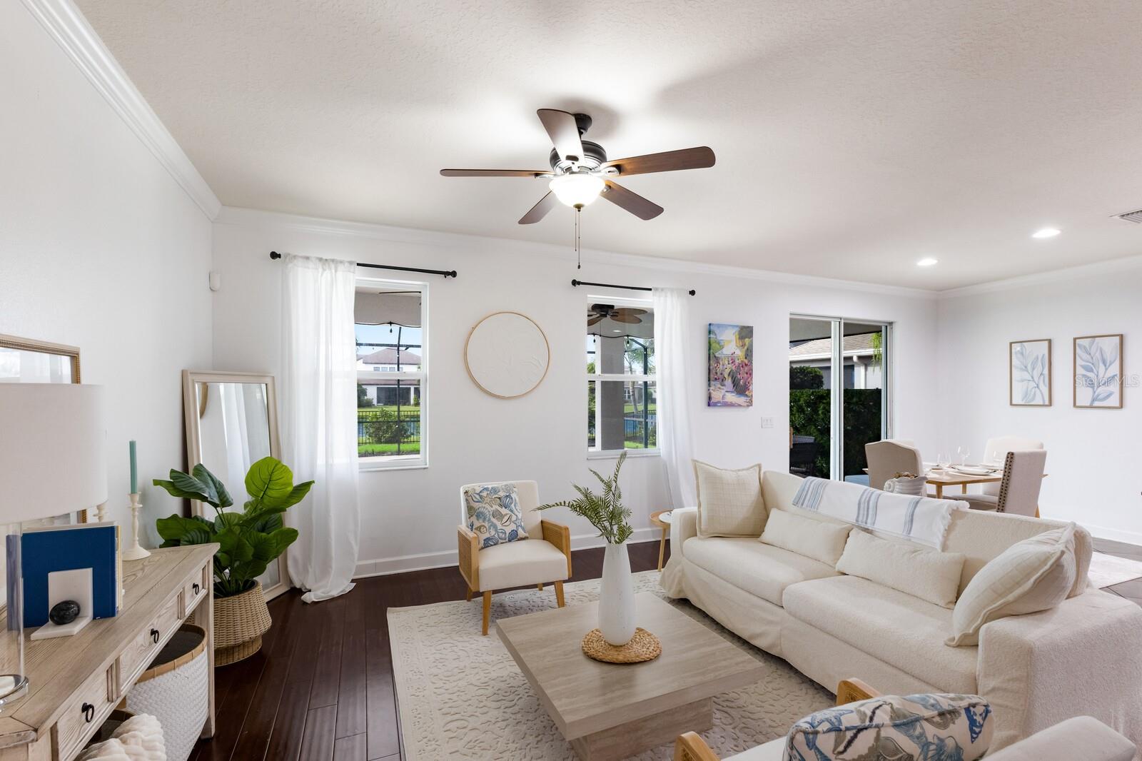 Rarely available and tucked behind the gates of Arbor Reserve! This move-in-ready, four-bedroom, three-bath Miramar-model home sits on a premier lakefront lot in a quaint, central location between University Parkway and State Road 70. With nearly 2,600 square feet under air, this home blends two levels of tasteful living space with functionality and modern comfort. Enter and you’re greeted by a large flex/office space, ideal for working from home or creating a private retreat. The open-concept main floor features rich engineered hardwood flooring, a spacious living and dining area, and an upgraded eat-in kitchen with granite countertops, gas range and a generous walk-in pantry. A guest bedroom and full bath with tub on the first floor create an ideal setup for multi-generational living or out-of-town guests. Upstairs, a sun-filled loft offers a flexible bonus space, while the split floor plan ensures privacy. The oversized primary suite features serene lake and tree-lined views, a large walk-in closet, and an en-suite bath with dual vanities and a walk-in shower. On opposite side of the home, you’ll find a spacious laundry room, a large guest bath with a tub and two additional bedrooms, each comfortably sized. Go outside to enjoy Florida living at its finest. The screened-in, saltwater pool is surrounded by lush newly installed landscaping and a new wrought-iron fence. The pool also features a new heater and new pump. The expansive covered patio is ideal for outdoor dining and lounging, with plenty of space to add an outdoor kitchen, all while enjoying peaceful lake views. This home is packed with upgrades that bring peace of mind and modern efficiency, including two newer Carrier HVAC systems (2021 and 2022), a whole-home Tesla solar generator system with three new batteries and a new computer system, and 100% owned rooftop solar panels, dramatically reducing your monthly electric bill and even allowing you to sell power back to the grid. Plus, you’ll never worry about power outages again. If the power goes out, your Tesla generator automatically switches on, giving you peace of mind during any storm. Additional notable upgrades include a new washer, dryer, dishwasher, a new irrigation system and enhanced curb appeal with fresh landscaping in the backyard. Arbor Reserve offers low HOA fees and resort-style amenities including a community pool, playground and a luxury cabana equipped with built-in grills, all in a quiet, beautifully maintained neighborhood (only 95 homes) close to top-rated schools, shopping, dining and more. Turnover in Arbor Reserve is incredibly low, and this is the only property available in the community.