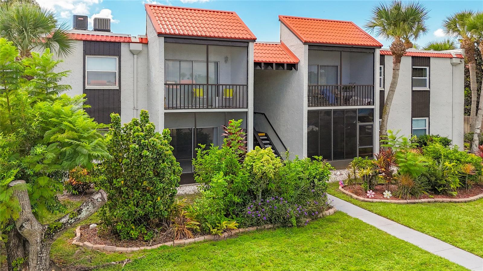 Come see this ground-floor condo located in the heart of Sarasota. This 2-bedroom, 2-bathroom condominium is tucked away nicely towards the back of the complex. Quiet, comfortable, convenient, and most of all affordable. Village Brooke is known for providing well-manicured landscaping, beautifully maintained amenities, and low condo dues. Association amenities include TWO neat-as-a pin heated pool areas, 2 tennis/pickelball courts, shuffleboard, peaceful ponds, covered gazebos, bike storage rack stations, barbeque areas, water, sewer, pest control, cable television, and a well-equipped club house complete with a full kitchen area, tables, pool/ping pong table, and lounge space with large screen TV. Wash and dry two loads of laundry at the same time in one of the many convenient laundry areas, one being located in this same building. Find coins to be cumbersome? Choose to use the smart phone app instead. This home really is the epitome of easy living less than 20 minutes to both Siesta and Lido Key beaches. This specific unit is located near the mailboxes, recycling, tennis courts, pools, and is walking or biking distance to many shopping and public transportation options. Please note that Village Brooke policies include pet, truck, and motorcycle restrictions, as well as 2 month minimum and 6 month maximum rental restrictions. Make an appointment to see this lovely first floor condominium unit.