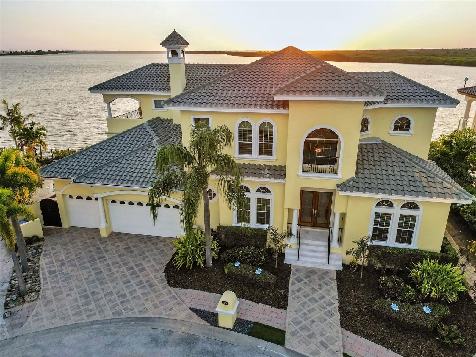 NO FLOODING / STORM DAMAGE from EITHER Hurricane! Rest assure your new home was built to withstand the two largest disasters in Tampa Bay History! Witness some of the most Captivating Sunsets and Open Water views in all of Tampa Bay! This Stunning waterfront residence located in the prestigious Reserve of Old Tampa Bay, a secluded gated enclave conveniently close to TIA, downtown Tampa, and St. Petersburg. Crafted by Alvarez, this home boasts over 130 feet of water frontage, providing spectacular sunsets year-round. A spacious chef’s kitchen features top-tier appliances and a walk-in pantry, while the expansive master suite includes dual bathrooms and closets, a steam shower, and a whirlpool tub. Outdoors, a generous pool with cascading waterfalls awaits, alongside amenities such as a whole-house audio system, Lutron lighting, two fireplaces, a 500-bottle wine cellar. Custom cabinetry adorns every space, complemented by an outdoor kitchen and a separate-entry exercise room. Enjoy the spectacle of dolphin and manatee sightings from two lanais overlooking the serene waters of Tampa Bay, complete with a sizable dock and 13k lb boat lift. See Feature sheet attached for additional information regarding the property. Custom Furniture & personal property also negotiable.