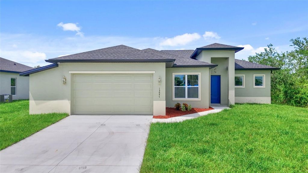 Photo of 13647 Begonia Circle, Port Charlotte, FL 33981 (MLS # O6333421)