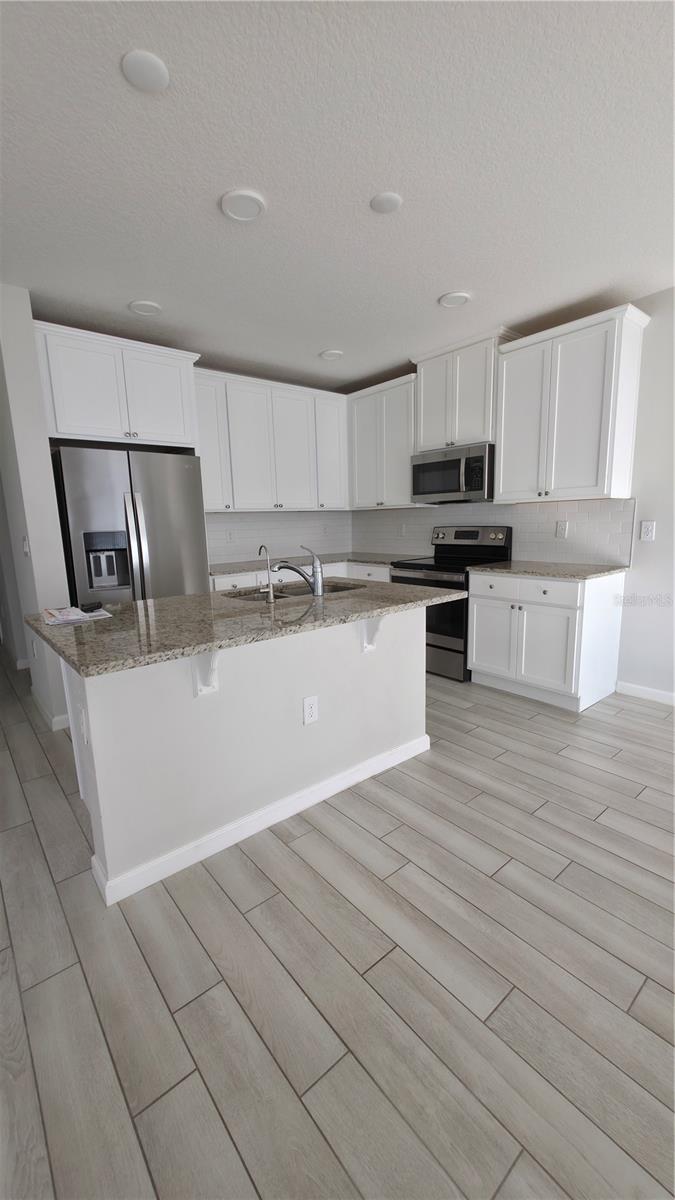 Welcome to Your New Home in St. Cloud, FL!
Discover this charming 4-bedroom, 3-bathroom townhome located in a peaceful and sought-after neighborhood of St. Cloud. As you enter, you’ll be greeted by a bright and inviting open-concept living and dining area, ideal for family gatherings or entertaining guests.
The modern kitchen serves as the heart of the home, featuring sleek countertops, stainless steel appliances, and ample cabinetry—perfect for all your culinary creations.
On the main floor, you’ll find a convenient bedroom—ideal for guests, in-laws. Upstairs, a spacious loft area connects the remaining three bedrooms, each offering comfortable space and natural light for rest and relaxation. The three full bathrooms are elegantly designed with contemporary finishes, creating a spa-like atmosphere right at home.
Enjoy the perfect location—only 8 minutes to Lake Nona, just 1 mile from shopping centers, and 20 minutes from Orlando International Airport. This home combines comfort, style, and convenience for your everyday living.