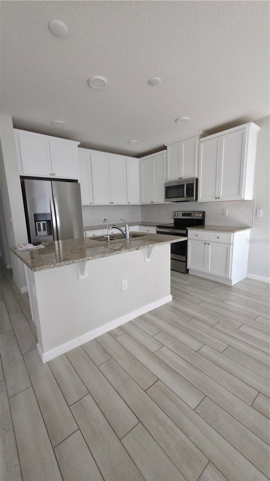 Welcome to Your New Home in St. Cloud, FL!
Discover this charming 4-bedroom, 3-bathroom townhome located in a peaceful and sought-after neighborhood of St. Cloud. As you enter, you’ll be greeted by a bright and inviting open-concept living and dining area, ideal for family gatherings or entertaining guests.

The modern kitchen serves as the heart of the home, featuring sleek countertops, stainless steel appliances, and ample cabinetry—perfect for all your culinary creations.

On the main floor, you’ll find a convenient bedroom—ideal for guests, in-laws. Upstairs, a spacious loft area connects the remaining three bedrooms, each offering comfortable space and natural light for rest and relaxation. The three full bathrooms are elegantly designed with contemporary finishes, creating a spa-like atmosphere right at home.

Enjoy the perfect location—only 8 minutes to Lake Nona, just 1 mile from shopping centers, and 20 minutes from Orlando International Airport. This home combines comfort, style, and convenience for your everyday living.