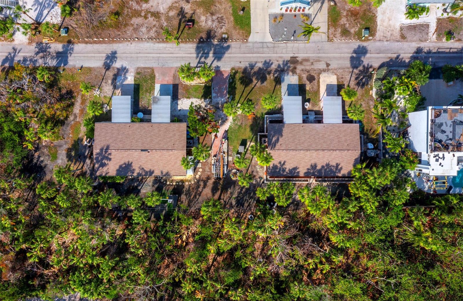 Rare opportunity for investment or rental opportunity on lot zoned for Duplex. Rebuild the current structure (1,135 Sq Ft 2 br 2 ba each side) or build your best version of a duplex rental property located on Longboat Key on this 9,000 sq ft lot Convenient North Key Location. The Gulf, Kayak/Sarasota Bay Access, Euphemia Haye Restaurant, Joan Duarte Park are literally at either end of the block on Gulf Bay Road. Public beaches, Anna Maria Island, Sarasota and St Armand’s Circle shopping area are short drive away. Adjacent property next door also available.