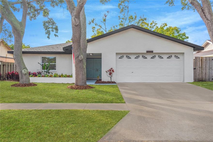 **PRICED TO SELL!** Welcome home to this charming 4-bedroom, 2-bathroom home located in the heart of Clearwater! This impeccably maintained residence offers a spacious and inviting layout, perfect for families or those who love to entertain.  Tons of curb appeal and gorgeous mature trees welcome you home and invite you to stay.  Beautiful and modern luxury plank flooring provides both stunning esthetics and waterproof durability. The bright and airy living spaces feature large windows that fill the home with natural light. The well-appointed kitchen boasts amazing ALL-WOOD cabinets, gorgeous GRANITE COUNTERTOPS, and STAINLESS STEEL appliances, making meal prep a delight.  An open concept floor plan is the perfect place for hosting parties and relaxing evening alike. The master suite provides a serene retreat with its en-suite bathroom, while the two additional bedrooms offer plenty of space for family, guests, or a home office.  A beautifully designed bathroom means everyone has plenty of peace and privacy.  Step outside to your private backyard oasis, ideal for relaxing or hosting summer barbecues.  Conveniently located near schools, parks, shopping, and dining, this home offers the best of Clearwater living. Don’t miss the opportunity to make this your dream home! Schedule a tour today and experience all this wonderful property has to offer!