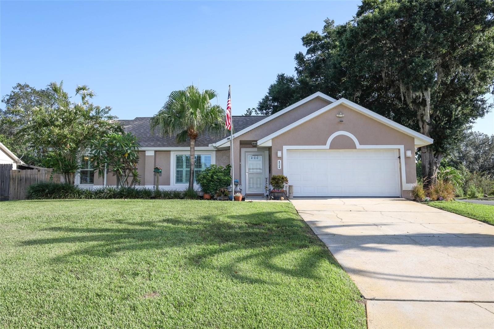 Welcome to this truly one-of-a-kind custom home in the sought-after, established community of Sunridge Woods, where charm meets modern luxury with a low HOA fee of just $195 per year. This 3 bedroom, 2 bathroom, 1,638 square foot home was completely rebuilt in 2021 from the block and slab up after a fire—reimagined, redesigned and rebuilt with exceptional care and attention to detail. Every element of the home was thoughtfully curated for luxury, comfort, and energy efficiency. Inside, you’ll find a bright, open floorplan that offers seamless flow from room to room—perfect for both everyday living and entertaining. The heart of the home is the stunning custom-designed kitchen featuring granite countertops, stainless steel appliances, a huge center island, large workstation farmhouse sink, and an abundance of storage. The oversized pantry is a dream, outfitted with solid wood shelving and interior lighting. The spacious primary suite offers a luxurious feel with an upgraded closet system designed for maximum organization. Both bathrooms feature frameless glass showers and upgraded fixtures—including the toilets—showcasing the meticulous level of quality found throughout. You’ll love the waterproof luxury vinyl plank flooring and elegant 5½-inch baseboards, as well as the solid wood interior doors throughout the home. Plantation blinds dress most of the windows, which are all double-pane for superior energy efficiency. The attic is insulated with energy-efficient Green Star foam panels, and the home is equipped with a hybrid heat pump water heater to keep utility costs low. Tech-ready with Cat-6 wiring in every bedroom, this home is built for the modern lifestyle. The entryway is enhanced by a full-view storm door, bringing in extra natural light while adding curb appeal and functionality. French doors with built-in blinds open to a large 19x19 screened-in, under-roof patio—perfect for relaxing in any weather. Unwind in the six-person hot tub or entertain guests on the brick paver patio, ideal for grilling or gathering around a fire pit. The oversized corner lot offers plenty of outdoor space, and the irrigation system is fed by a private well, so you never have to worry about watering costs. For even more storage or workshop space, there's an 8x14 insulated shed complete with electricity and air conditioning. Located just minutes from Champions Gate, you'll enjoy easy access to world-class golf courses, shopping, dining, and entertainment. With quick access to I-4, commuting to Orlando, Tampa, or the area’s theme parks is a breeze. If you're looking for a custom home that stands out from the rest—crafted with care, filled with upgrades, and designed for comfort—this is the one. Don't miss your chance to own this beautifully rebuilt custom gem—there really is nothing else like it.