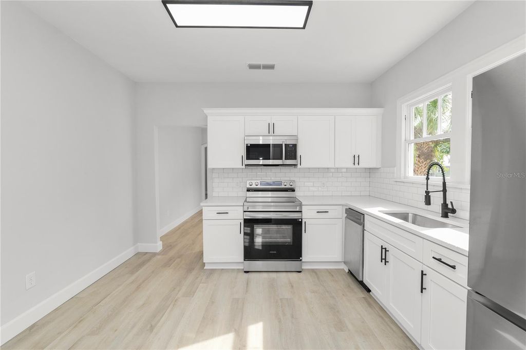 Photo of 26 S Lanier Avenue, Fort Meade, FL 33841 (MLS # L4958651)