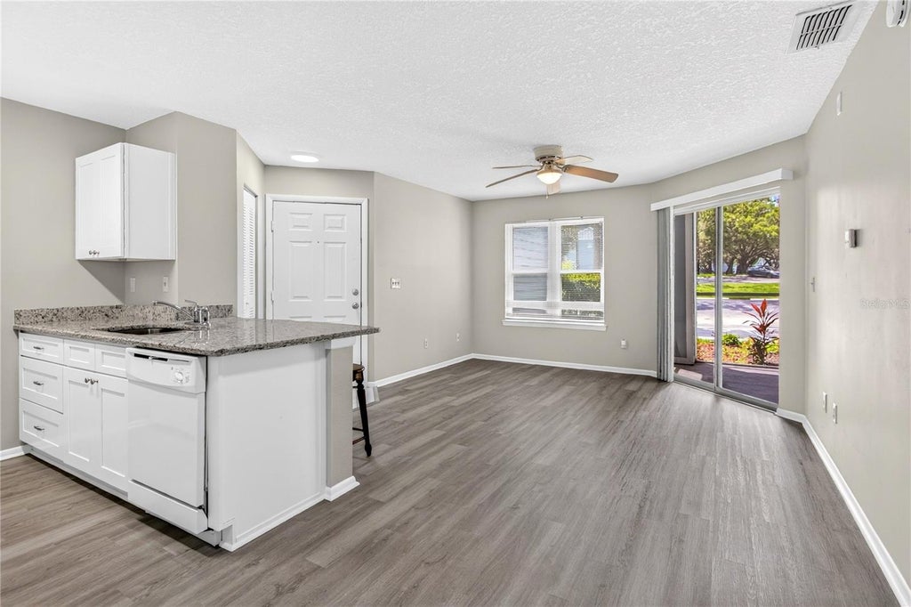 Photo of 2561 Grassy Point Drive #103, Lake Mary, FL 32746 (MLS # O6423269)