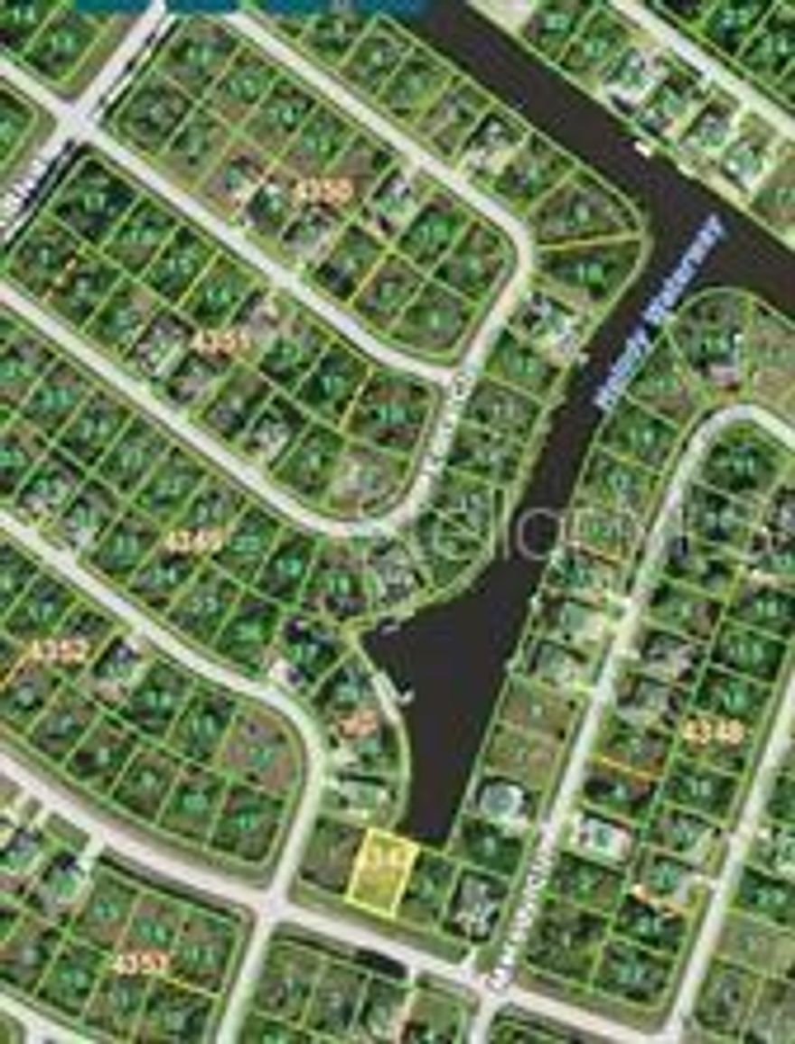 Great price on this waterfront lot looking straight down the canal for a beautiful long canal view!  50 ft of waterfront on the canal.  Build your home with this spectacular view down canal.  Sit in your pool and enjoy the view.  Great neighborhood.  Priced to sell.  Buy now and build later on one of the lowest priced waterfront lots in the subdivision.  Keep your boat in your backyard with quick and easy access to Charlotte Harbor.