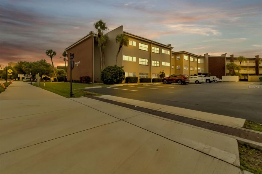 MOVE IN READY and affordable 2nd floor condo in the heart of the medical district in Port Charlotte.   This well-maintained 1 bedroom condo has plenty of space to add a pull out couch or a privacy screen and a bed in the Florida/Bonus room.  It is bright and airy, and feels larger than the square footage indicates.  The kitchen has granite counters and ample cabinets.  The unit comes with a dedicated parking space and the complex has guest parking too. Exterior windows are impact resistant and FEMA shows that it is NOT IN A FLOOD ZONE (X). Conveniently located in the Parkside District, you are close to hospitals, shopping, grocery stores, restaurants and recreational activities such as boating, fishing, golfing, Charlotte Harbor access & pickleball courts. Enjoy the community pool and laundry facilities as well as locked access entry points. Only residents and their guests can access the property. There are a few common areas to relax and converse with your friends & neighbors as well as a few pieces of exercise equipment for resident usage. Basic cable, wifi & water/sewer is included in the monthly fee. Several Gulf beaches are approximately 45 minutes away. Fishermen's Village & downtown Punta Gorda is approximately 12 minutes south and Sunseeker Resort is just before that. GREAT OPTIONS FOR ENTERTAINMENT AND FIRST CLASS DINING.  Make an appointment TODAY to see this adorable and affordable residence.