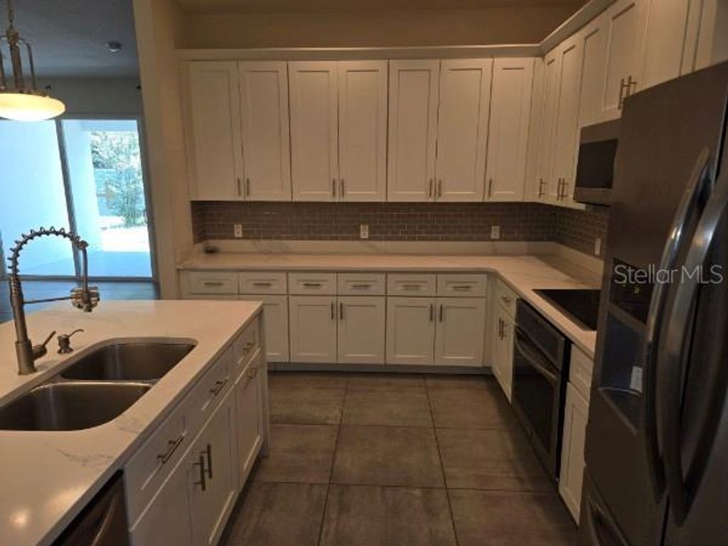Photo of 922 Centaury Drive, Kissimmee, FL 34759 (MLS # O6410711)