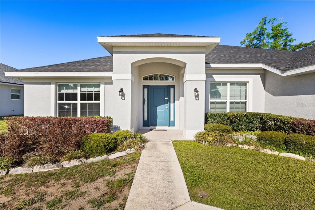 Photo of 345 Ashton Woods Lane, Leesburg, FL 34748 (MLS # O6392593)