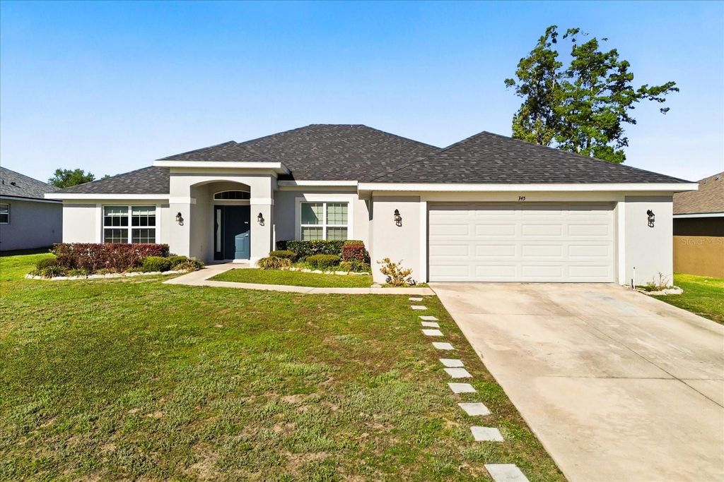 Photo of 345 Ashton Woods Lane, Leesburg, FL 34748 (MLS # O6392593)