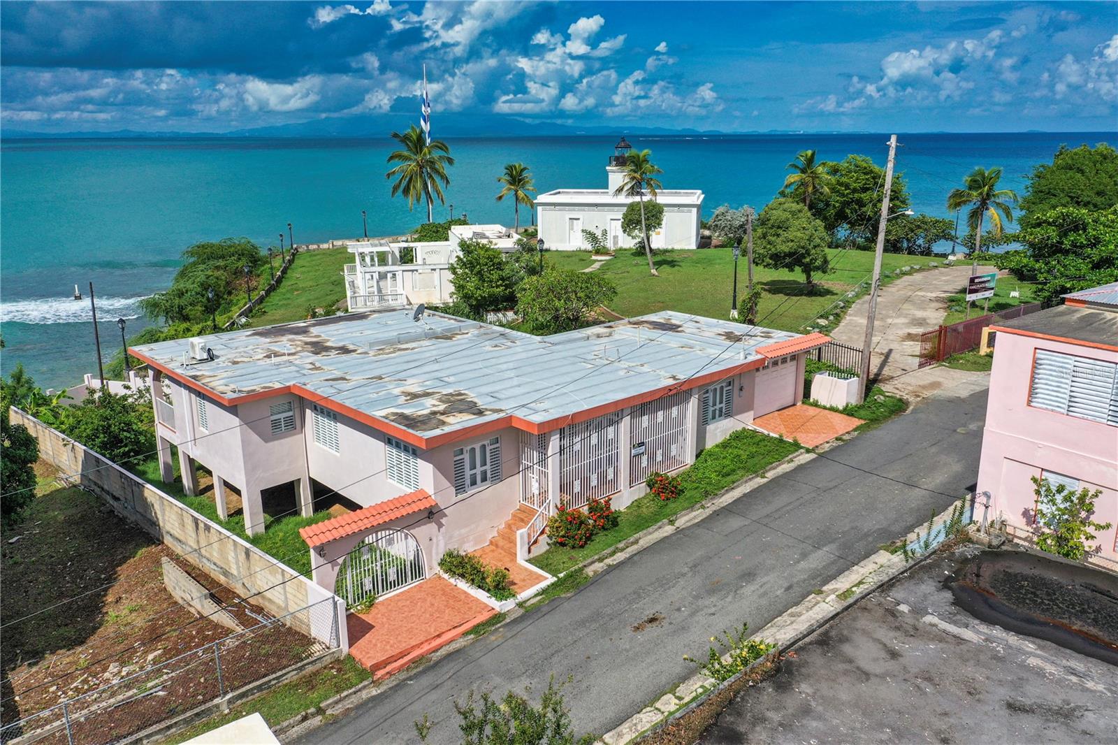 La Casa Frente al Mar is an oceanfront oasis overlooking the Vieques Harbor.
Discover your Caribbean paradise with this five-bedroom, two-bathroom oceanfront home, perfectly situated to capture breathtaking views over Vieques Harbor. This move-in-ready residence offers an invitation to experience Vieques Island life upfront!
Wake up each morning to the peaceful sounds of the ocean lapping at the shore, and watch fisherman as they head out for the day or return with their fresh catch. From your vantage point, you can also see the ferry making its way across the sea from Puerto Rico to Vieques Island, adding a touch of local charm and vibrancy to the serene surroundings.
The is house is thoughtfully designed with a spacious bedrooms that welcome gentle breezes and large windows framing the scenic beauty of Vieques Island. As the sun dips below the horizon, your are treated to some of the most beautiful sunsets over the Caribbean sea, filling your evenings with stunning hues and a tranquil ambiance. Whether entertaining guests on the patio or enjoying a quiet moment alone, the mesmerizing views and sounds of the ocean will be your constant companions.
La Casa Frente al Mar is conveniently located near the town of Isabel Segunda with steps to the ferry, fisherman's market, restaurants, bars, shopping, pharmacy, doctors offices, the plaza, government offices and beaches.
With move-in ready convenience and everything you need to embrace island life, this Vieques harbor oceanfront property is a true gem. Don't miss the chance to own this slice of paradise.