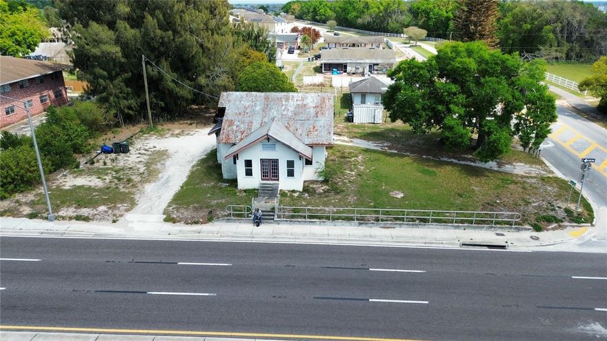 Prime redevelopment opportunity located in the heart of Lake Alfred along the city’s main corridor. This highly visible property sits directly on a divided highway through the central stretch of town, offering excellent exposure and accessibility.

The property currently includes three residential units, all of which are tenant-occupied, providing potential interim income while future plans are considered. With its strategic location along a major thoroughfare and within close proximity to local businesses, dining, and community amenities, the site presents significant potential for future redevelopment or investment.

Whether you’re looking to hold as an income-producing property or explore development possibilities in a growing area, this property offers exceptional visibility and location within Lake Alfred’s main commercial corridor.