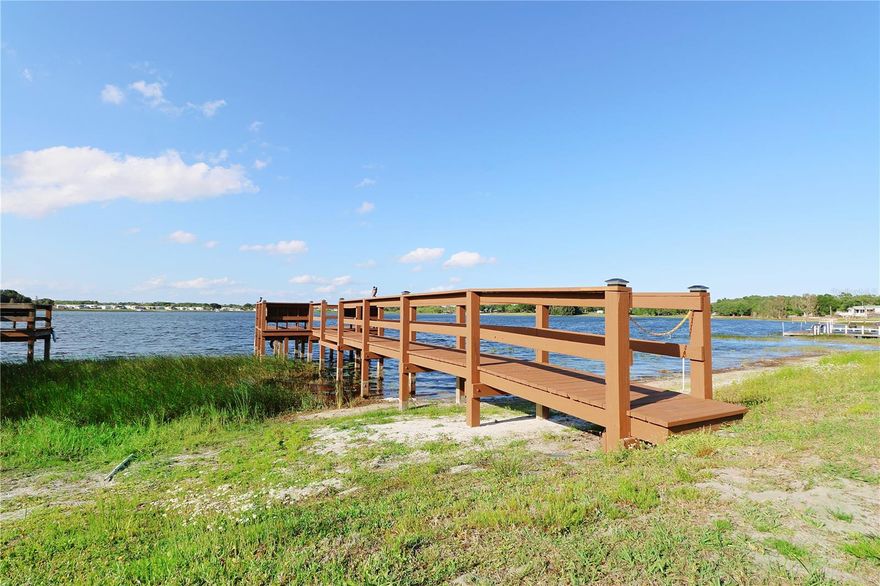 Welcome to your ideal 55+ LAKEFRONT retreat in beautiful Lake Wales! Situated in a well-established and friendly 55+ RV community, this lakefront lot offers the perfect combination of comfort, convenience, and resort-style living. The property features a paved RV pad for easy setup and low maintenance, along with a storage shed—ideal for tools, outdoor equipment, or seasonal items.  Enjoy direct waterfront living with your own private 65-foot dock, built in 2020 and recently pressure washed and resealed—perfect for relaxing, fishing, or taking in the peaceful lake views.  Whether you're a seasonal visitor or planning to stay year-round, this lot is move-in ready and designed for effortless enjoyment. Residents have access to a variety of amenities, including a lakefront clubhouse, community pool, shuffleboard courts, community dock, and an on-site laundry facility—providing plenty of opportunities to relax and stay active.  The low HOA fee adds exceptional value, covering sewer, water, garbage, and grounds maintenance for truly low-maintenance living. The community also offers on-site storage for trailers and similar equipment, as well as access for boat launching.  Don’t miss this rare opportunity to own an affordable piece of Florida lakefront living with outstanding amenities in a peaceful setting!