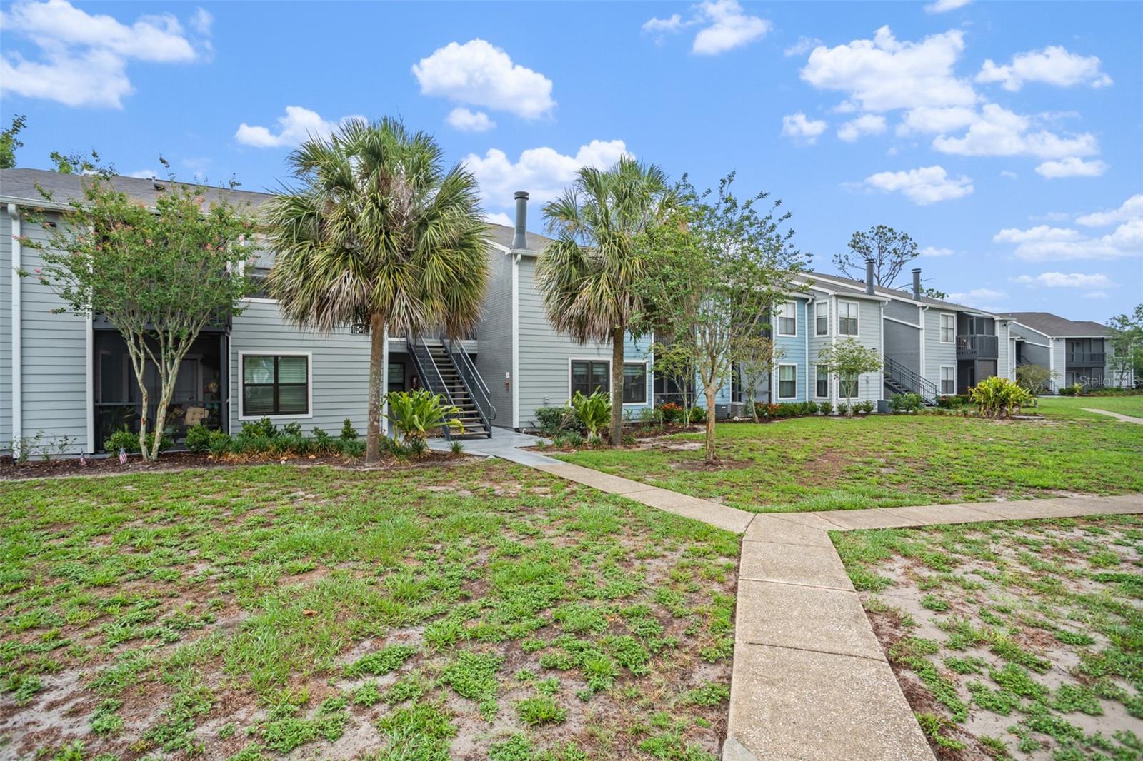 Under contract-accepting backup offers. **This house comes with a REDUCED RATE through the seller's preferred lender. This is a lender-paid rate buydown that reduces the buyer's interest rate and monthly payment.** This is a charming and move-in-ready 2-bedroom, 2-bathroom condominium offering just under 900 square feet of comfortable living space in the heart of Casselberry. Step inside to find laminate flooring throughout, creating a warm and cohesive feel. You're greeted by a cozy living room, perfect for relaxing or entertaining. Just ahead, sliding glass doors open to your screened-in porch, providing a peaceful, bug-free space with serene views of the grassy common areas — your own private retreat. The primary bedroom, located just off the living room, features a built-in closet and a private ensuite bathroom complete with a tub/shower combo. Conveniently situated just outside the primary suite is the galley-style kitchen, equipped with white cabinets with stylish gold hardware, stone countertops, stainless steel appliances, and a laundry closet nearby. A serving window opens to the dining area, along with a breakfast bar that adds functionality and charm. The second bedroom also includes a built-in closet and sits adjacent to the second full bathroom, which boasts a glass-enclosed, floor-to-ceiling tiled walk-in shower and modern stone countertop. This home offers a perfect blend of comfort, style, and practicality — a true blank canvas ready for your personal touch.