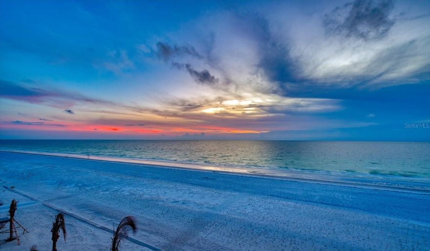 WHERE EVERY WINDOW IS A MASTERPIECE!!!  Dan's Island on Sand Key Beach, Gulf-Front, Move-In Ready!  Some addresses simply command attention. This residence at Dan's Island on Sand Key Beach is one of them, a front-row Gulf-front retreat where the horizon stretches endlessly, the sunsets are legitimately dramatic, and every single day feels like a vacation you never have to leave. Step onto your wrap around balcony and let it sink in: the shimmer of the Gulf, powder-white sand below and those tangerine-and-coral sunsets that Sand Key is legendary for. This isn't a view. This is a lifestyle.  The kitchen has been completely reimagined for the way people actually cook and entertain. Gleaming new quartz surfaces, a sleek convection/induction range, and a full suite of new appliances, including your own wine refrigerator make this a space you'll genuinely want to spend time in. The trash compactor is a small luxury that becomes a daily convenience you'll quickly wonder how you lived without. Both bathrooms have been thoughtfully updated with new toilets and quartz countertops, they are clean, crisp, and ready for move-in. When the evenings cool down, the new electric fireplace sets the mood without any fuss. Brand-new A/C system, less than a year old, means you're covered for years to come.  Unit is tastefully furnished and ready for you to unpack your clothes and stay!  Additionally, dedicated beach-gear storage right on your floor keeps the sand where it belongs. Dan's Island isn't just a building, it's a resort-caliber community where amenities rival properties twice the price: a 24-hour guard-gated entrance, two heated Gulf-front pools and spas, private beach access, grill areas with private dining, a fitness center, an indoor basketball/racquetball court, and a stunning clubhouse with a full kitchen, billiards, a wet bar, and dual Gulf-view balconies. The Milestone Inspection and Reserve Study have both been completed with zero issues, offering genuine peace of mind in today's market.  This is not a condo you settle for. This is the one you remember driving away from every visit and the one you stop leaving the moment you make it yours.