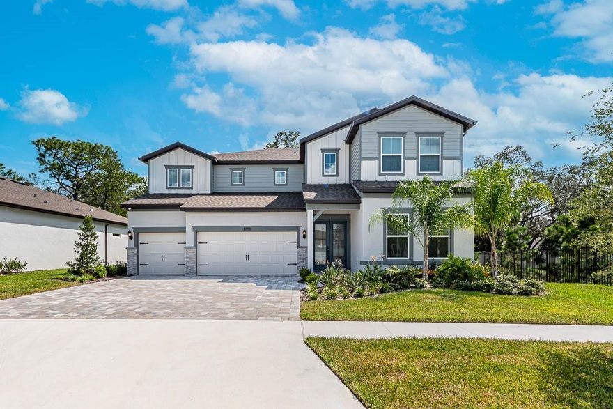 Welcome to your newly completed dream home, an exquisite four-bedroom plus a flex room (could be a 5th bedroom) sanctuary boasting not one but two full master bedrooms and a total of four luxurious bathrooms. This residence was meticulously designed to provide you with the epitome of modern living. From the welcoming living room and gourmet open kitchen to the formal dining room, office, and versatile flex room downstairs, every inch of this home exudes elegance and functionality. Outdoors, you'll discover a beautiful oasis with a fully equipped kitchen featuring a Blaze grill, stove, fridge, and ample seating, all under an extended and covered lanai, ensuring year-round enjoyment. Inside, upgrades abound, including a stylish backsplash in the kitchen and wine room, upgraded light fixtures throughout, and custom window treatments including motorized shades in the master bedroom and a custom sound system extends throughout the living room, kitchen, and lanai. Security is a top priority, with an installed system complete with interior and exterior cameras. As an added convenience, the washer and dryer convey with the sale. This home isn't just a residence; it's a lifestyle, offering you the perfect blend of luxury and comfort. Don't miss the opportunity to experience this exceptional property for yourself—schedule a private showing today and step into a world of unparalleled elegance and convenience. Your dream home is ready to welcome you.