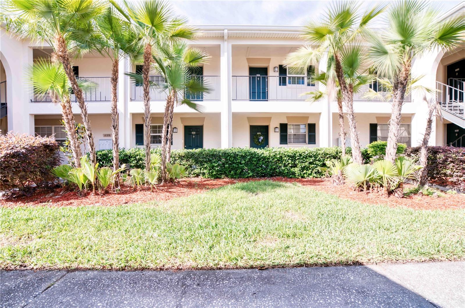 Welcome to The Grand at Olde Carrollwood! Enjoy a relaxed, resort style recreational lifestyle at this amazing and upscale pet-friendly West Tampa community featuring two pools, phenomenal clubhouse, fitness center, tennis courts, grilling area, plus breathtaking irrigated pond surrounded by walking paths and wildlife. Do not miss out on this incredible opportunity to own a spacious 2nd floor 2 bedroom, 2 bathroom end unit at a competitive price with both pond and pool views! With just a little TLC, this condo could be simply AMAZING! Boasting one of the more spacious 2 bedroom floorplans, this perfectly situated unit totals 1190 heated/cooled square feet in addition to a large screened in back porch with storage area. Open concept Living/Dining area with wainscoting and built in shelves. Sizeable kitchen features pass through window to living area, matching appliances and closet pantry. Large master bedroom with ensuite bath and walk-in closet. Hallway with additional closet space leads to good sized second bedroom and guest bath with tub/shower combo. Washer & Dryer laundry closet. Covered, designated carport parking. Excellent proximity to groceries, shopping and restaurants! Just 20 minutes to Bush Gardens and a half hour to downtown Tampa! Call to schedule your appointment today for an opportunity to live in in this fabulous, upscale yet affordable West Tampa community!