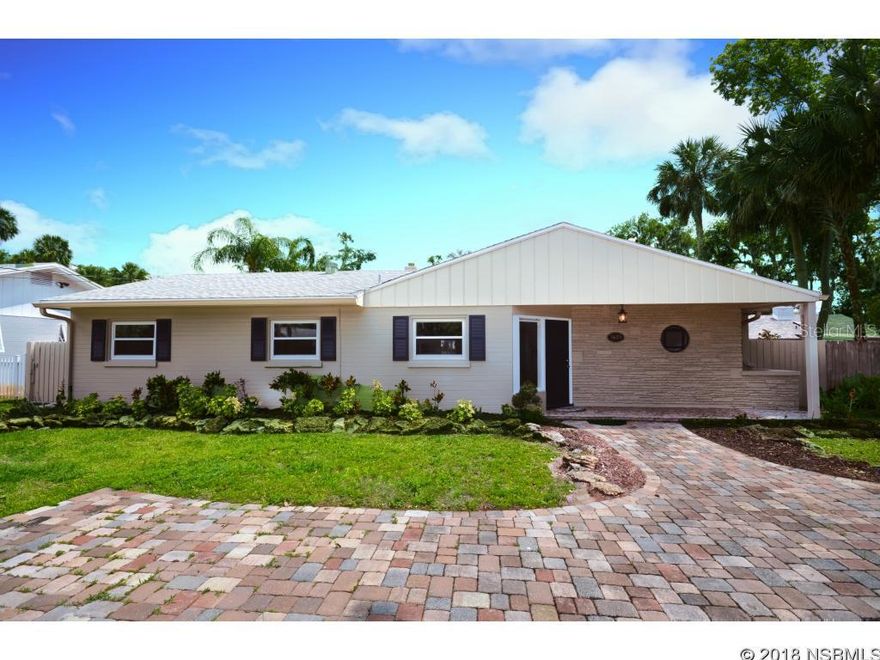 House with an Open floor plan and lots of windows in the Family room/Sunroom and living area. Sunroom has tongue and groove ceiling and separate door to back yard. Kitchen is open to a large greatroom area for dining and living. A door in the kitchen opens to a large laundry/mudroom  area with generous cabinets and space for craft room or additional pantry. The great room has an access door to out door patio and deck for evening cook outs. Master bath offers new tiled shower glass enclosure, vanity and granite counters. Guest Bath for the two additional bedrooms has been up dated as well.  Bedrooms are good size with updated trim package and windows for good light and views of outdoor area.  All windows with exception of Sun Room are impact. This home offers large fenced back yard with Rear entry into the garage and yard.  Room for pool, RV, or Boat.  Freshly painted inside and out.  One street over from Riverside Dr. so you have easy access to Riverside path for biking and walking to Restaurants and shopping. ;Water: City