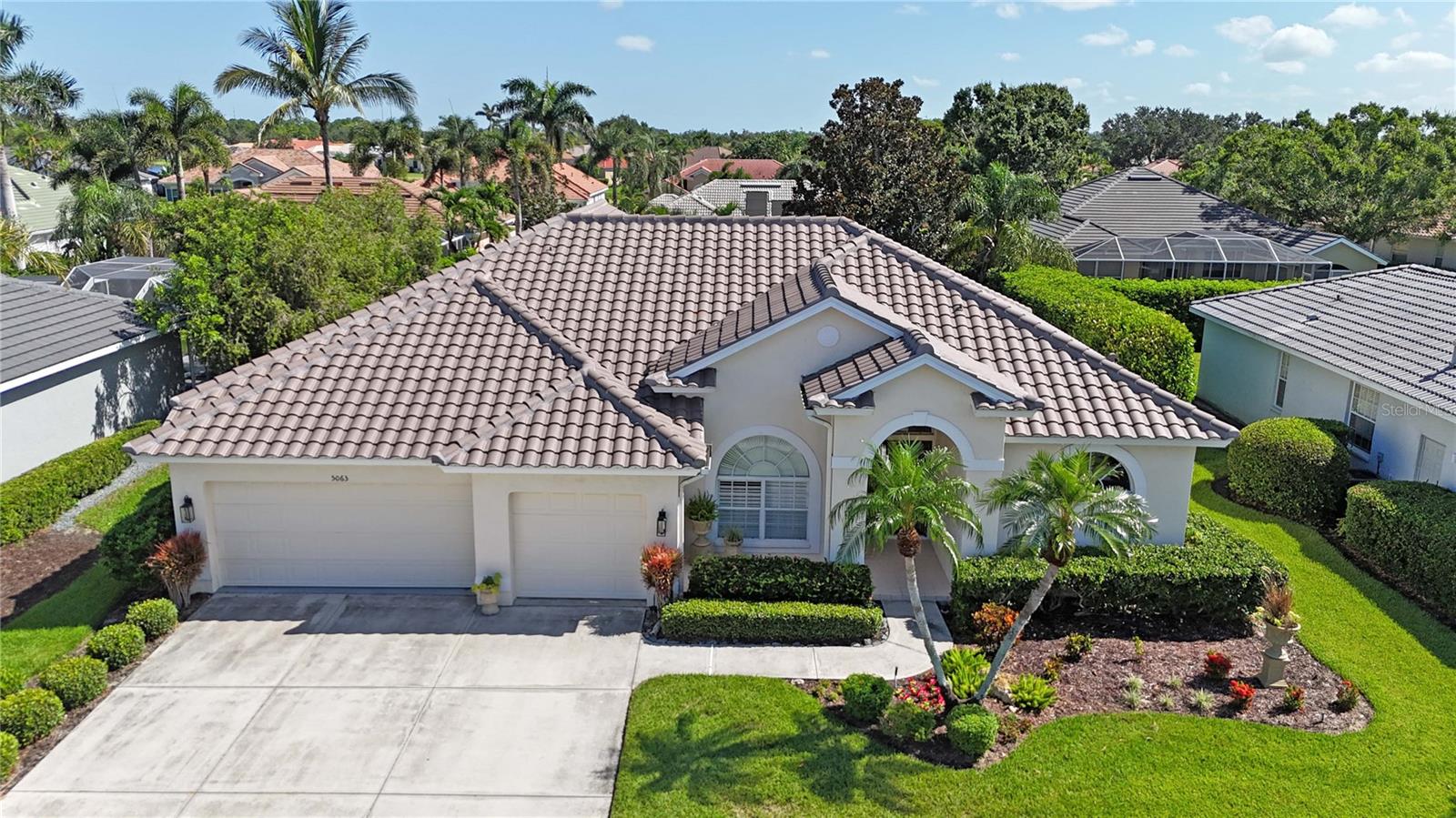 Come live the Florida lifestyle to the fullest in this very well maintained 4- BEDROOM + 3- BATHROOMS+ 3 CAR GARAGE + POOL AND HEATED SPA , residence with a BRAND NEW ROOF, located in the sought after, GATED community of Turtle Rock within Palmer Ranch. Nestled in one of Florida’s top-rated school districts , this home offers both elegance and peace of mind with recent upgrades that include fresh interior and exterior paint, modern lighting, updated appliances, enhanced landscaping, to name a few. Step inside to find a gracious formal living area that frames a serene, private tropical backdrop—arguably one of the most secluded views within the subdivision. Designed with a thoughtful split layout, this home spans 2,558 square feet of pure comfort, offering generous space and privacy for each bedroom. The kitchen is well-appointed with granite countertops, recessed lighting, ample storage in the oversized pantry, and updated stainless steel appliances. The primary suite features direct access to the lanai, abundant closet space, and a spa-style bathroom complete with a jetted soaking tub and walk-in shower. Ideal for indoor-outdoor living, the home showcases pocketing sliding glass doors that reveal a secluded backyard paradise. Relax to the soothing sounds of the spa spilling into the shimmering pool, all surrounded by lush, mature landscaping that ensures total seclusion from neighboring homes—perfect for entertaining or peaceful retreat. A separate POOL BATH WITH EXTERIOR ACCESS adds convenience for guests enjoying the outdoor space without disrupting the flow of the main interior. The low monthly HOA fees include the reclaimed water service for lawn irrigation , grants access to a suite of amenities including a community pool, clubhouse, tennis courts, basketball/pickleball area, and over 300 acres of natural preserves, lakes, and scenic trails.(NO CDDS) Turtle Rock also thrives on community spirit, offering a rich calendar of social events and active clubs. There's always something to enjoy and new neighbors to meet. With Legacy Trail, Costco, Publix, and a host of restaurants and shops just beyond the community gates, the location could not be more convenient. This exceptional property won’t be available for long—schedule your private tour today!