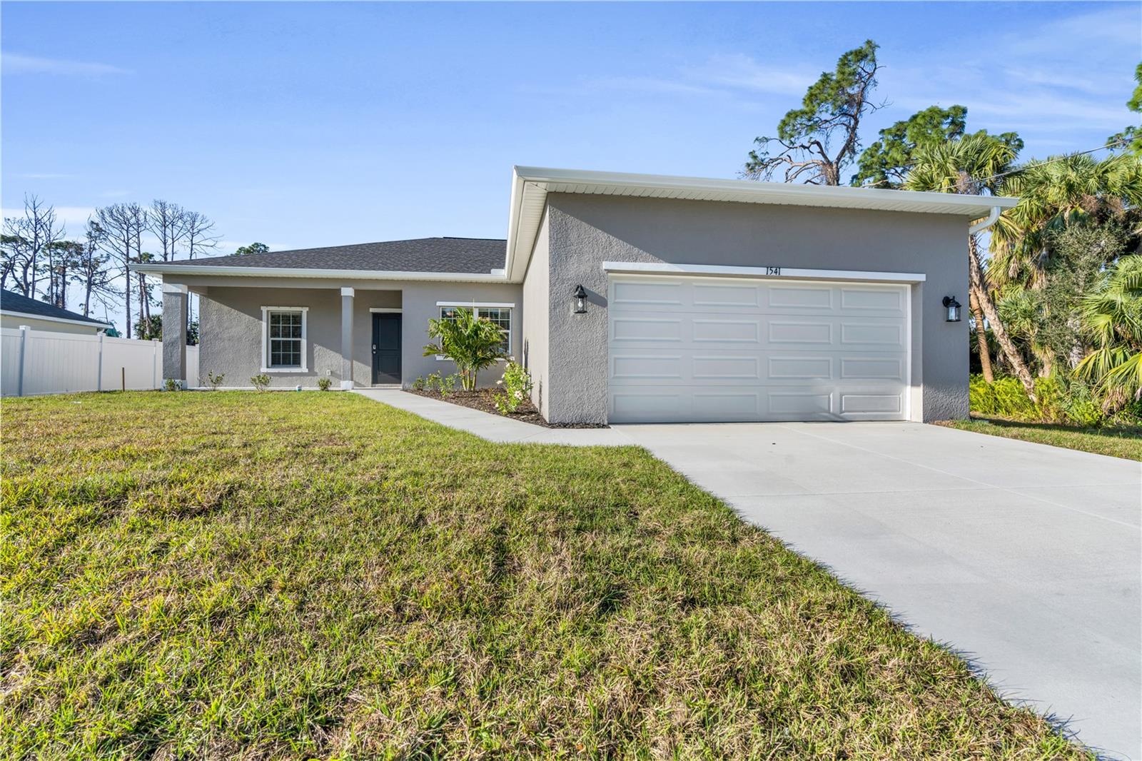 UNDER CONSTRUCTION. COMPLETION FIRST WEEK OF SEPTEMBER. Gorgeous and BRAND NEW 3/2/2, 1548sf, split floorplan home located in a nice neighborhood with city water in the Gulf Cove area. This home has a grand great room entrance into a beautiful open floor plan. You’ll notice in the foyer, that the home has high (9’4”) ceilings, a tray in both the great room and master, gorgeous luxury vinyl plank flooring throughout, granite countertops, stainless appliances, IMPACT WINDOWS, and much more. The Master Suite two walk in closets and leads to the Master Bath with double sinks and an all tile shower. The second and third bedrooms share a “Jack and Jill” style bathroom. All of the rooms are spacious and comfortable. If entertaining is your thing, the back sliders lead out to a huge covered lanai. In Port Charlotte, you are always near world class beaches (Siesta Key, Englewood, etc), surrounded by golf courses, restaurants, shopping, boating, fishing, and even Minor League and Spring Training baseball!