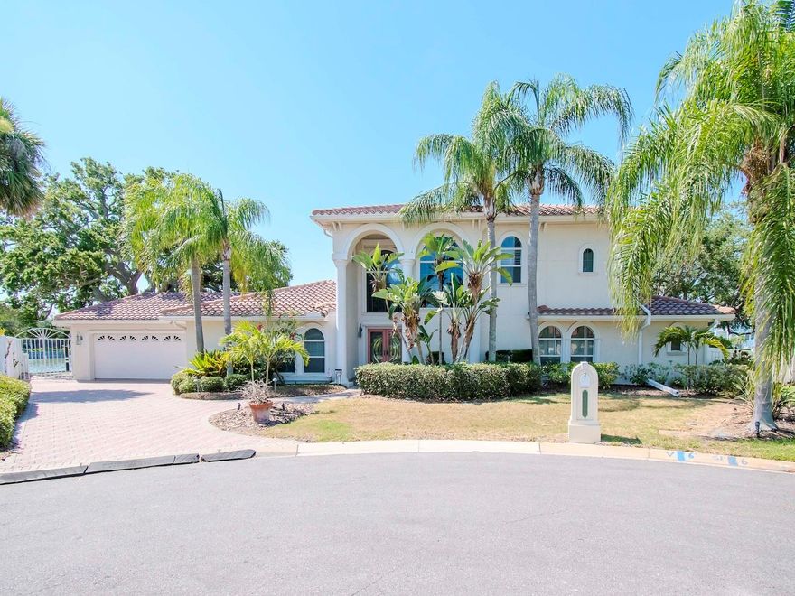 Unique Home on a Remarkable Waterway. A boater's dream!  The waterfront accommodates a yacht up to 70 feet in length, with a new boat lift for vessels up to 34 feet (never used) and a second lift for boats up to 18 feet. The dock, one of the ten largest residential docks in Pinellas County, offers over 200 feet of waterfrontage with a new seawall, providing ample backyard space to bask in the Florida sunshine. The large backyard features a blend of sunlit spaces and shaded areas under the majestic grandfather oaks.  Inside you will find a spacious home with 3 bedroom, 2.5 baths, family room, living room, game room, exercise room and more. The master retreat spans the entire second level, featuring a spacious en-suite bath, custom closet treatments, and an in-room coffee service bar with a sink. Swing open the French doors of the master suite to enjoy the expansive balcony overlooking the pool and waterfront.
Downstairs, entertain guests in the billiard room, highlighted by a mesmerizing 450-gallon custom saltwater aquarium. The living room offers a custom bar with a keg cooler.  Some additional features you'll find: Whole house generator (Generac), storm shutters, 2 custom commodes with lighting/bidet/auto open & close/heat, additional mini-splits in bedrooms, tankless water heater, and more.
This home is brimming with too many features to list and is certainly worthy of a personal visit. Don’t miss the chance to make this extraordinary property your home – one of the finest waterfront locations available in the area.