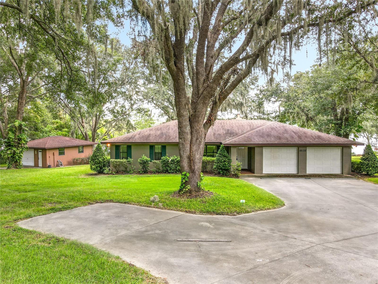 Over an acre of secluded Paradise on crystal clear Lake Gibson. When you drive up to this home you will immediately feel the peacefulness and see the lush yard with large oak trees. The property slopes down to the lake with 203 feet of frontage. Boat dock and 18x24 detached workshop. Back porch is perfect for your morning coffee. This one owner home has been kept in excellent condition. Features split bedroom plan, living room and spacious family room with brick fireplace, eat in kitchen with dining room and living room could be turned into third bedroom. Bring your boat and your toys and enjoy waterfront living!