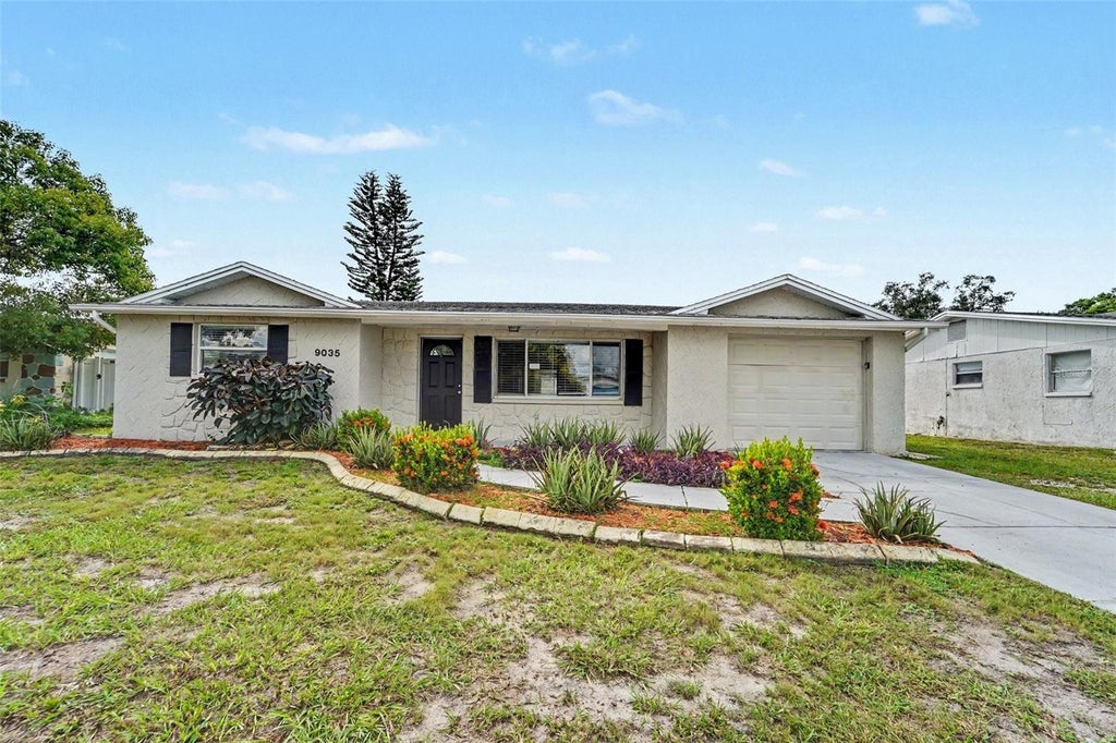 Photo of 9035 Saint Regis Lane, Port Richey, FL 34668 (MLS # O6445773)