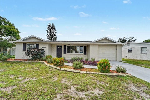 Photo of 9035 Saint Regis Lane, Port Richey, FL 34668 (MLS # O6445773)