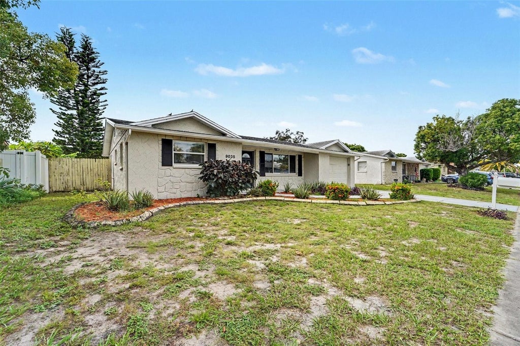 Photo of 9035 Saint Regis Lane, Port Richey, FL 34668 (MLS # O6445773)