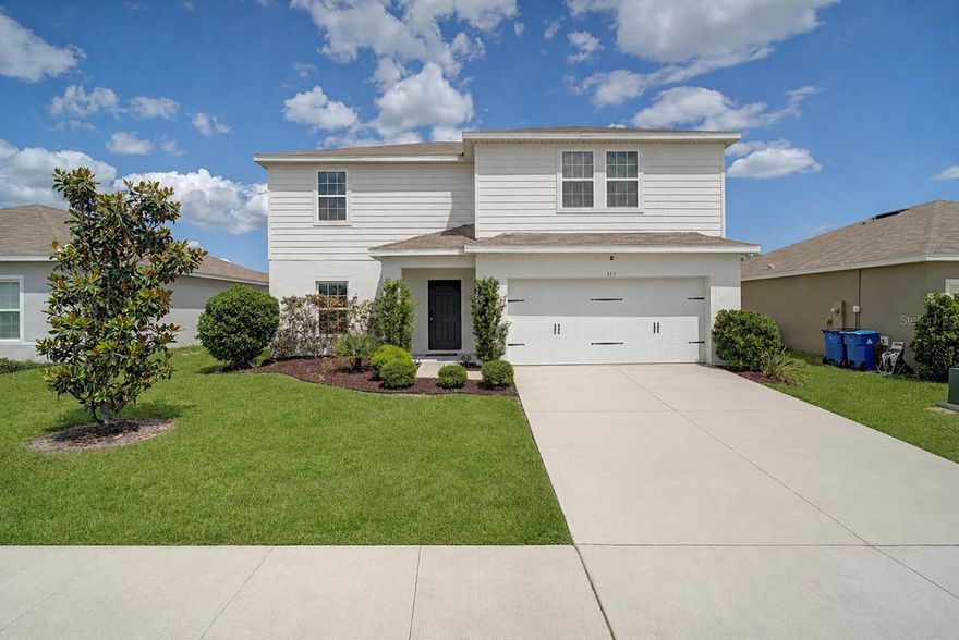 One or more photo(s) has been virtually staged. Welcome home to your like new beautifully upgraded 4-bedroom, 2.5-bath home tucked away on a quiet cul-de-sac. Built in 2021, this spacious two-story residence offers 2,232 square feet of thoughtfully designed living space. The open-concept layout features extended tile flooring throughout the main living areas and a stunning white kitchen complete with ample cabinetry, a full stainless steel appliance package, and elegant finishes. Enjoy the added curb appeal of upgraded landscaping and the comfort of a move-in-ready home. You will love this homes huge backyard, fenced in for privacy and safety—perfect for entertaining, relaxing, or weekend gatherings. The home also includes a water purification system for added convenience. Ideally located near shopping, dining, and Central Florida’s top attractions, this property is perfect as a primary residence or a second home retreat. Don’t miss the opportunity to own this stylish, well-maintained gem—schedule your showing today!