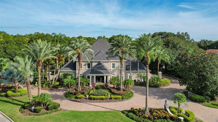 Your opportunity to live in the National HGTV Award-Winning Outdoor Oasis! An artistry of space packing a powerful WOW factor with additional APSP International Award of Excellence Gold, Pinnacle Luxury Pool Award, and The World’s Greatest Pool Award! This stunning 5 Bedroom, 5.2 bath, newly remodeled 6141 sq ft estate has 3 floors of complete luxury. Situated in THE RESERVE Tampa Bay's most sought-after premier neighborhood. A truly charming, gated community manned w/ 24-hour security personnel waiting to welcome you home. The expansive architectural finishes flow throughout this stunning golf front estate nestled near the 2nd hole of Tampa Palms Golf & Country Club. This estate has too many attributes to list (pls see MLS attachment) including newly remolded kitchen, 2018 roof, custom office, bonus rm expanding the entire 3rd  floor, resort style pool area w/ summer kitchen, numerous large Firepits, 6 outside TV’s, fireplace, fire sculpture, inground trampoline w/ drain, perimeter fencing w/ automatic sprayers, and play area. Again, wow! With his/her double side entry garages, plus additional outside parking perfect for golf carts and guests, you will never run out of space! The front entrance will impress any guest with the spectacular portico, outside chandelier, 18 ft custom entry doors and 30+ ft soaring foyer. Whether you are conducting a meeting in your executive office or entertaining in your formal dining rm, living rm or open concept kitchen to family rm, ALL will feel the ambiance of this dynamic property! The large 1st floor Master Bedroom suite has a en-suite Master Bath w/ walk-in roman tub, push button Privacy Smartglass shower and washroom doors, his/her vanities and closets. Opposite the Master Suite, the newly remodeled Gourmet Kitchen makes for perfect entertaining. A literal dream kitchen with oversized custom countertops and top-of-the-line appliances including a dedicated drink/coffee bar and special-order nugget ice maker. Additional master suite and 2 Guest Bedroom Suites are located upstairs w/ lots of large closets and tons of storage. The bonus area expanding the entire 3rd floor is for your desires, waiting to meet any need. Entire house, inside and out, can be monitored from your phone including electric window treatments. A MUST-SEE HOME AND COMMUNITY WITH SO MANY ADDITIONAL UPGRADES NOT LISTED! Ride your bike to Tampa Palms Elementary, a top elementary school. A short drive to I75 & 275, shopping, dining, recreation, USF, VA Hospital, Florida Hospital, Moffitt, and downtown Tampa. Don’t miss this unique opportunity to own a dream oasis!