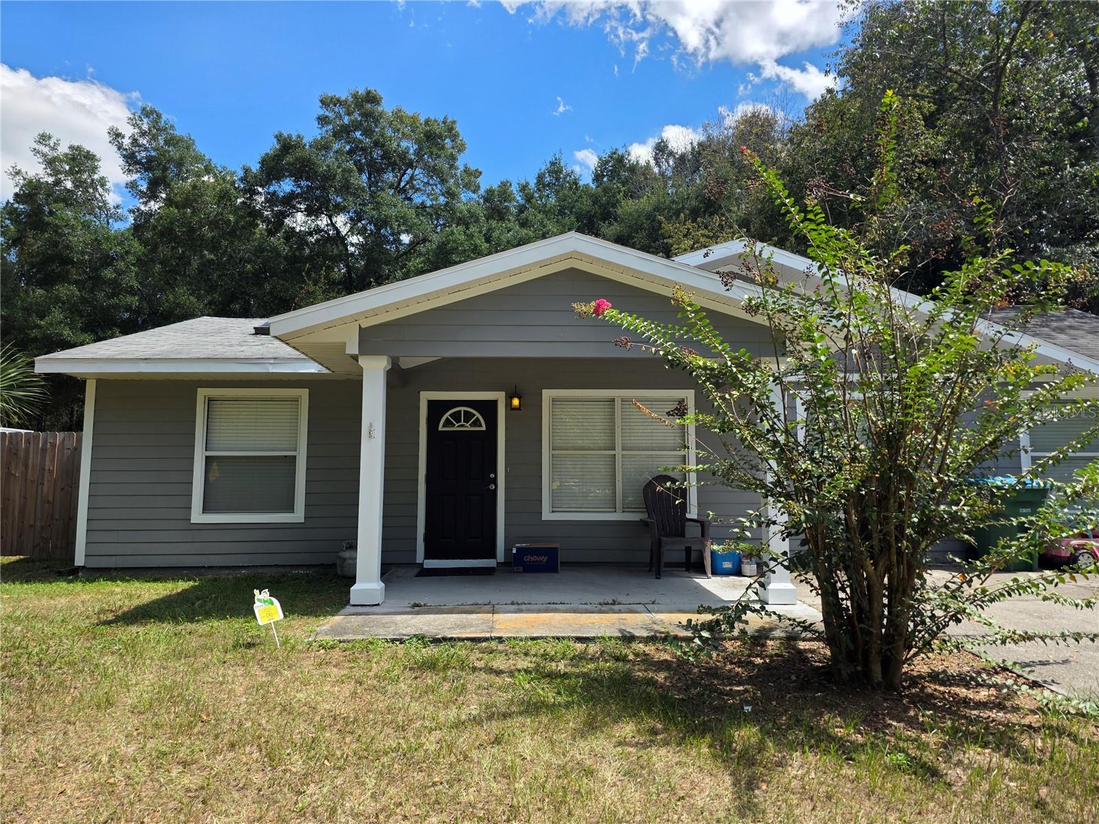 Needing extra space? Look no further! If you need room to grow, this Newberry home has 5 bedrooms and 2 bathrooms. It sits on a fully fenced and oversized lot, complete with a separately fenced off portion that is perfect for the pups. Freshly painted and brand new carpet in the bedrooms. Worry free laminate in the living, kitchen, and dining areas. The garage has been converted and has 2 bedrooms, as well as a private entrance, perfect for an in-law suite or home office. High ceilings and skylights flood the home with natural light. Well appointed kitchen with stainless steel appliances, granite countertops, and breakfast bar. The huge backyard offers plenty of privacy and shade. Located just blocks from all 3 Newberry schools and the downtown restaurants, 10 miles to Gainesville, 17 miles to University of Florida, and 18 miles to some of the natural springs that North Florida has to offer.