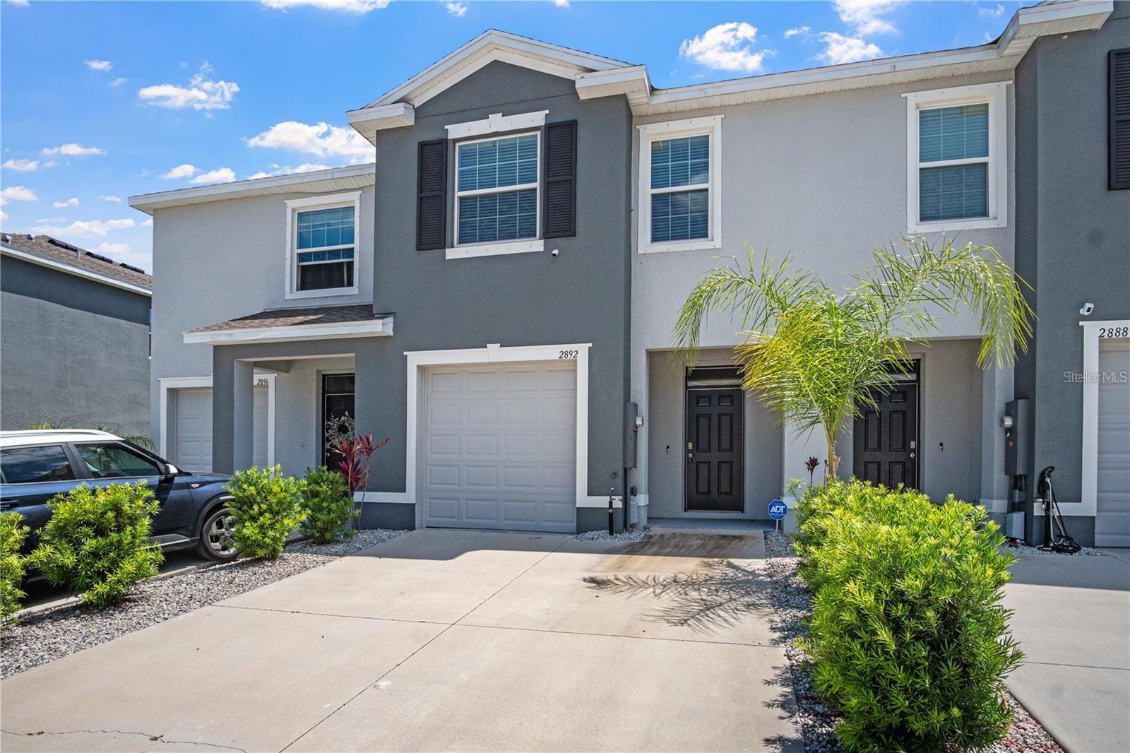 Welcome to your new home in The Preserve at South Branch—a vibrant, amenity-rich community offering comfort, convenience, and carefree living. This 2021-built, 3-bedroom, 2.5-bath townhome with a 1-car garage is move-in ready and perfect for those seeking a low-maintenance lifestyle. The HOA covers all exterior maintenance, including lawn care, so you can enjoy your time without worrying about yard work or upkeep. Inside, you’ll find an open and airy first floor with beautiful tile flooring throughout. The gourmet kitchen features granite countertops, stainless steel appliances, a center island, and ample cabinet space—perfect for cooking and entertaining. A convenient half bath is located downstairs for guests. Upstairs, the spacious primary suite offers a walk-in closet and a luxurious en-suite bath with dual vanities and a walk-in shower. Two additional bedrooms and a full bathroom provide plenty of space for family, guests, or a home office. Step outside to relax on your large covered lanai—ideal for morning coffee or evening unwinding. As a resident, you’ll enjoy access to incredible community amenities including a sparkling pool, playgrounds, a gym, basketball court, dog park, soccer field, bike paths, and more. Located just off the Veterans Expressway, this home offers quick and easy access to Tampa and surrounding areas. Don’t miss your chance to live in this beautiful, low-maintenance home—call today to schedule your private showing!