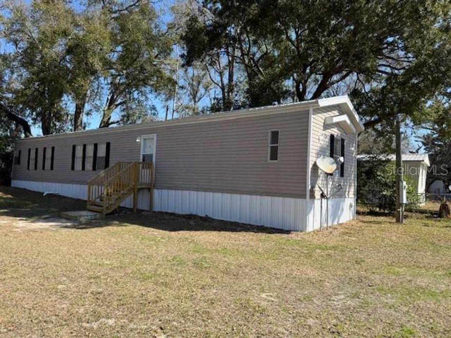 Welcome home to this beautifully renovated 3 bedroom, 2 bath singlewide situated on a spacious 1/3-acre lot in Chiefland. This charming property has been thoughtfully updated, making it the perfect option for first-time buyers, downsizers, or investors. Step inside to find fresh interior paint, brand new flooring throughout, and a comfortable living room designed for everyday relaxation. The split floorplan offers privacy, with the primary suite separated from the additional bedrooms making it ideal for families or guests.
The kitchen shines with brand new appliances and ample cabinet space, creating a bright and functional space for cooking and gathering.
Major upgrades provide peace of mind, including a brand new metal roof and brand new AC system, ensuring energy efficiency and low maintenance for years to come. Outside, enjoy the generous 1/3 acre lot with plenty of room for outdoor entertaining, pets, gardening, or future improvements. Affordable, updated, and move-in ready. Schedule a tour today! Priced to sell this Chiefland gem won’t last long!