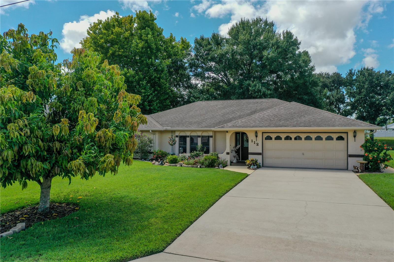 Welcome to your serene retreat in Sun N Lakes Estates, where waterfront living meets modern comfort. This charming two-bedroom, two-bath home is perfectly situated on a tranquil canal, granting you direct access to the expansive 500+ acre Lake Grassy, known for its sandy bottom and recreational opportunities. Step inside to discover a thoughtfully designed open concept layout that enhances both space and light. The vaulted ceilings create an airy ambiance, while the living and bedroom areas are adorned with plush carpeting for added comfort. The kitchen is a culinary delight, recently updated with elegant granite countertops, brand-new cabinetry, and stainless steel appliances. An inviting L-shaped breakfast bar and a convenient pass-through window with bar seating connect the kitchen to the expansive screened back porch, ideal for entertaining or enjoying your morning coffee. The backyard oasis is a true highlight, featuring a delightful assortment of fruit trees and bushes, including bananas, pineapples, blueberries, lemons, ruby reds, and mangoes. This lush garden path leads you to your own canal waterfront, complete with a dock and boat slip that boasts a new metal roof and decking—perfect for weekend adventures on the water. Additional features include hurricane shutters for peace of mind and a convenient cul-de-sac location that offers both privacy and tranquility. This home is also in close proximity to shopping and local amenities, ensuring you have everything you need just moments away. Don't miss this opportunity to embrace the ultimate Florida lifestyle! Schedule your private showing today and experience all that this exceptional property has to offer.