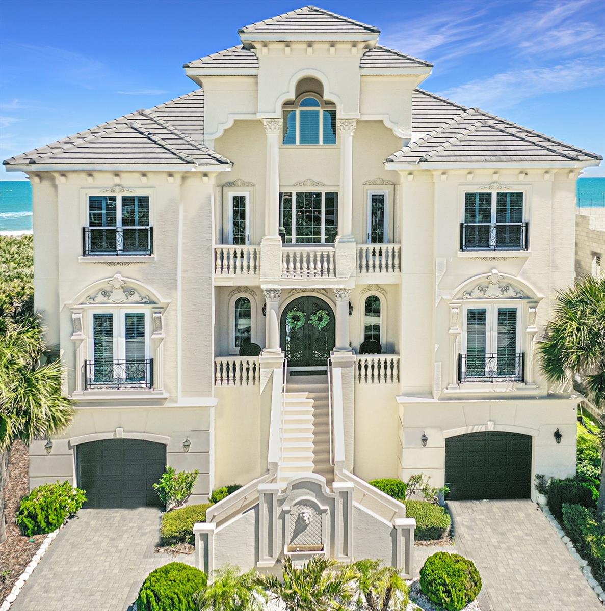 Introducing an Unmatched Luxury Oceanfront Estate! This property boasts 70 feet of pristine Atlantic Ocean coastline, offering stunning ocean views from every corner of the home. Known as "The Sea Princess Castle," this remarkable residence is situated within the exclusive Ocean Hammock Golf Community. The estate features 10 soundproof bedrooms and 9 bathrooms, along with a Home Theater and three distinct levels of balconies and verandas, perfect for relishing the soothing sounds of the ocean and the picturesque coastline. Top of the line elevator from garage level to all levels for ease of access to every level. The main level showcases elegant marble flooring, coffered ceilings, and more captivating views. The chef's kitchen is adorned with lustrous granite counter tops, a double oven, a spacious breakfast bar, and an expansive island, complemented by an abundance of cabinetry. This floor also includes two bedrooms, an office, and a striking entry foyer featuring custom wrought iron and leaded glass doors. On the top floor, you will find a private bedroom lounge with breathtaking ocean vistas. The third floor is dedicated to the Master Suite, which includes a personal coffee station, allowing you to savor your morning brew on your private balcony overlooking the pool and the ocean waves. This level also accommodates three additional soundproof bedrooms, each with its own en suite bathroom. Downstairs, you can unwind at the bar equipped with a refrigerator, dishwasher, cabinetry, and ice maker. The den/family room, complete with its own living area, is perfect for playing pool, and there is another Master bedroom with an en suite bath. The expansive pool area is ideal for hosting Fourth of July celebrations, providing ample space for friends to gather, grill, and enjoy cocktails at the summer kitchen bar. FOR THE MOST DISCRIMINATING IN TASTE! Pls make an appt for your private showing today!