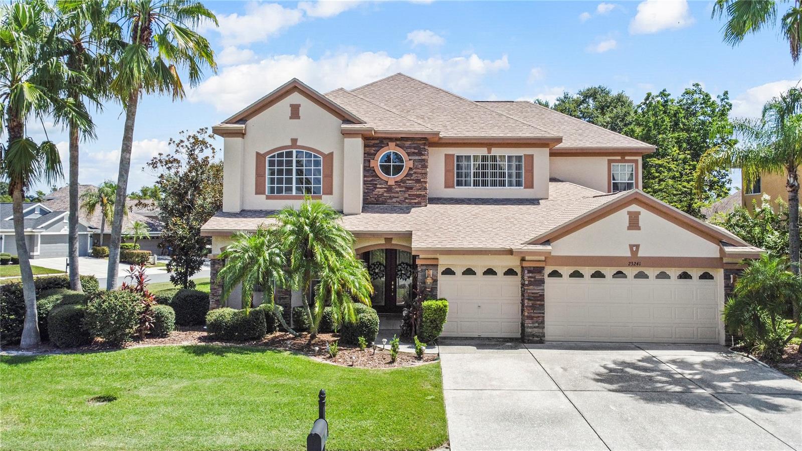 JUST LISTED WITH EXCEPTIONAL VALUE — 23241 Abercorn Lane, Land O' Lakes, FL 34639. Nestled in the highly sought-after Plantation Palms Golf Community, this stunning two-story residence offers the perfect combination of elegance, comfort, and modern upgrades. Featuring 5 bedrooms, 3.5 bathrooms, and 3,961 sq. ft. of living space, this home sits on an oversized 12,083 sq. ft. corner lot with a fenced backyard, ideal for pets and privacy.
Built in 2004 and meticulously maintained, the property boasts a new roof and exterior paint (2023), a dual-zone A/C system with the main unit replaced in 2019, and newer stainless-steel appliances including dishwasher, stove, and microwave (2023). The spacious layout showcases high ceilings, oversized windows, formal living and dining areas, and a gourmet kitchen complete with breakfast bar, walk-in pantry, and stylish finishes.
The oversized master suite provides a true retreat with a walk-in closet and spa-like en-suite bath. Additional highlights include a large bonus room—perfect for a media room, office, or playroom—an indoor laundry room, and a 3-car attached garage. Step outside to enjoy your own private oasis: a screened-in heated pool with spa, surrounded by a lush fenced yard.
Situated on a desirable corner lot within Plantation Palms Phase 5, residents enjoy a gated entry, golf course access, clubhouse, and proximity to the Land O’ Lakes Recreation Complex. The home is zoned for top-rated Pasco County schools and is just minutes from outlet shopping, dining, entertainment, and the Suncoast Parkway for easy commuting.
This rare opportunity combines space, upgrades, and community living at its best. Schedule your private showing today and discover why this Plantation Palms home is the perfect place to call your own!