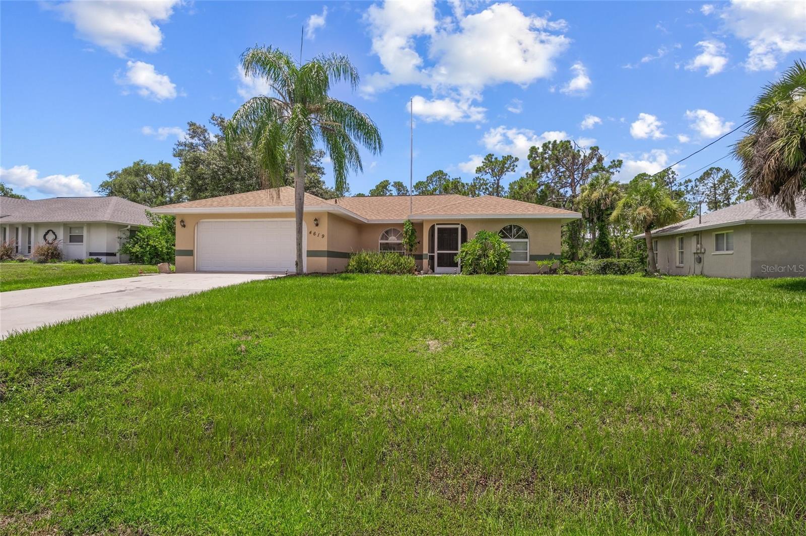 Price adjustment!! Walk into your new home at 4619 Flint Drive and enjoy the view of your built-in pool! This fabulous 3-bedroom, 2-bath residence boasts a spacious 2-car garage with a new Hurricane Rated GARAGE DOOR 2024, an expansive driveway accommodating four additional vehicles, and a shed/workshop with electricity in the backyard. The ROOF is also new from 2020! A/C was new in 2019 and has been maintained and serviced. Step onto the luxurious dark vinyl plank flooring and brand new carpet in the bedrooms, and cathedral ceilings in the living room. Delight in the separate dining room and a charming breakfast dinette area offering delightful views of the alluring built-in pool. Unwind on the lanai with its convenient built-in bar and food prep area, pool heater, and refreshing outdoor shower, all set against serene natural woodlands. POOL PUMP was new in 2023. The kitchen and bathrooms showcase elegant granite countertops and stylish faucets, exuding timeless sophistication. The primary bedroom features a lavish en suite bathroom with a skylight, shower, and spacious walk-in closet. Revel in the privacy of the two additional bedrooms located on the opposite side of the home. Meticulously cared for, this residence is an outstanding abode that exudes warmth and charm. NO HOA fee, NO CDD Fee!! It should be on your list!!