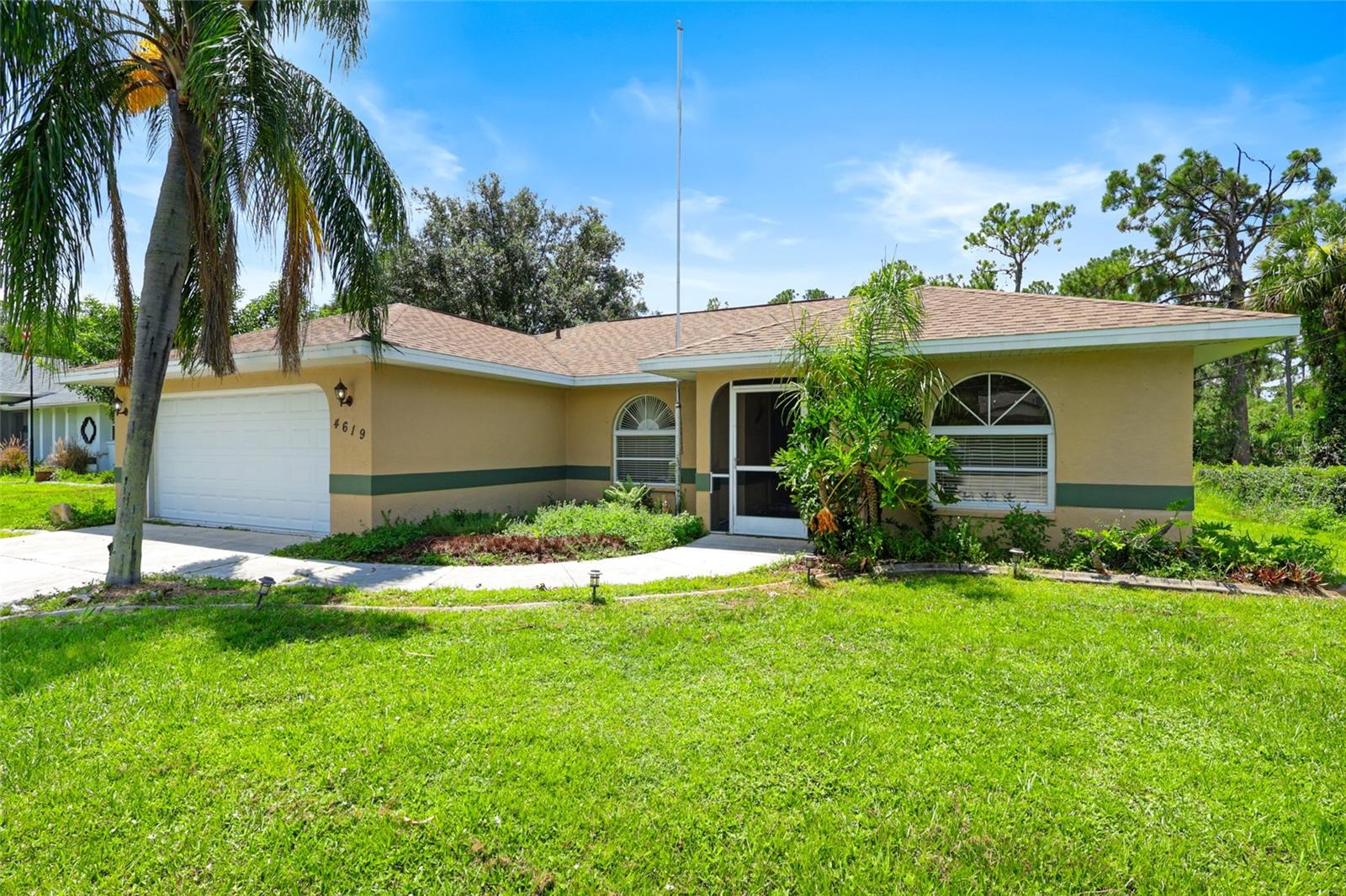 Price adjustment!! Step into your new home at 4619 Flint Drive and enjoy the view of your built-in pool! This fabulous 3-bedroom, 2-bath residence is move-in ready, boasting a spacious 2-car garage with a new Hurricane Rated GARAGE DOOR 2024, an expansive driveway accommodating four additional vehicles, and a shed/workshop with electricity in the backyard. The ROOF is also new from 2020! The A/C was new in 2019 and has been maintained and serviced. Step onto the luxurious dark vinyl plank flooring and brand-new carpet in the bedrooms, with cathedral ceilings in the living room. Delight in the separate dining room and a charming breakfast dinette area offering delightful views of the alluring built-in pool. Unwind on the lanai with its conveniently built-in bar and food prep area, pool heater, and refreshing outdoor shower, all set against serene natural woodlands. The pool PUMP was new in 2023. The kitchen and bathrooms showcase elegant granite countertops and stylish faucets, exuding timeless sophistication. The primary bedroom features a lavish en suite bathroom with a skylight, shower, and spacious walk-in closet. Revel in the privacy of the two additional bedrooms located on the opposite side of the home. Meticulously cared for, this residence is an outstanding abode that exudes warmth and charm. NO HOA fee, NO CDD Fee!! It's ready for you to move in and make it your own!